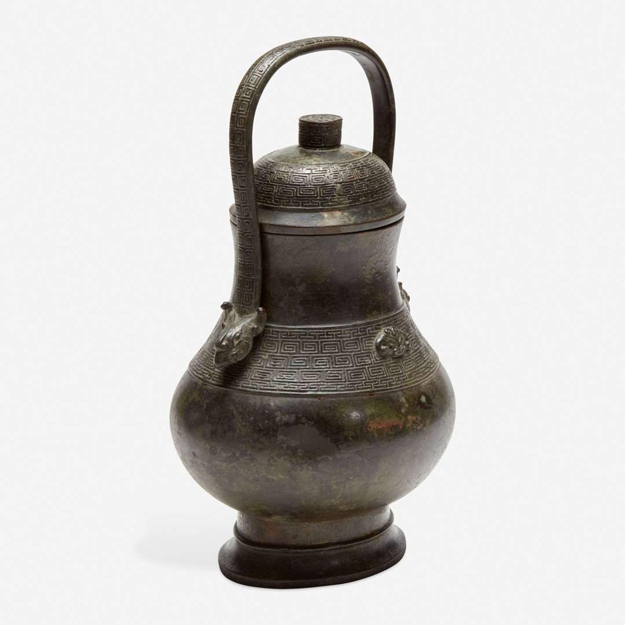 A Chinese archaistic patinated bronze covered wine vessel, you 倣古风格卣 late Ming/Qing dynasty ?????