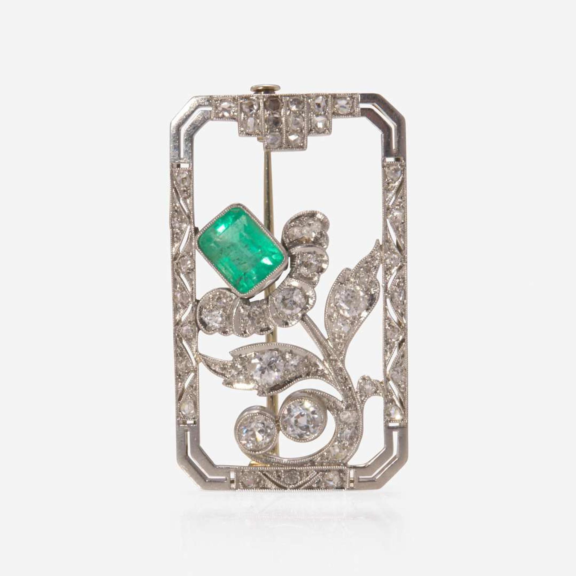 An 18K White Gold, Diamond, and Emerald Brooch