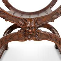 A Pair of Italian Carved Walnut Savonarola Chairs