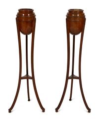 A Pair of George III Style Mahogany Urn Form Jardinière Stands