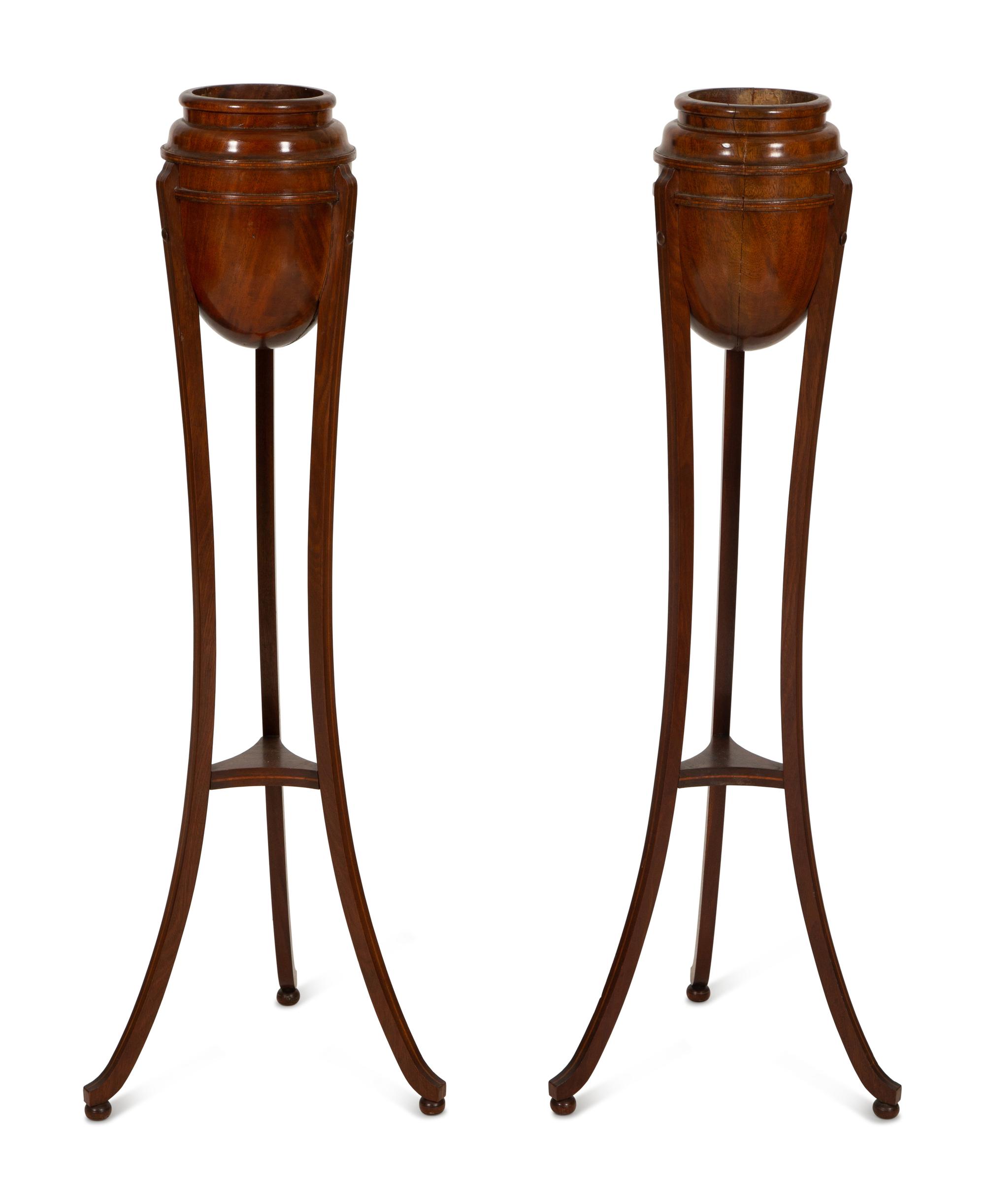 A Pair of George III Style Mahogany Urn Form Jardinière Stands