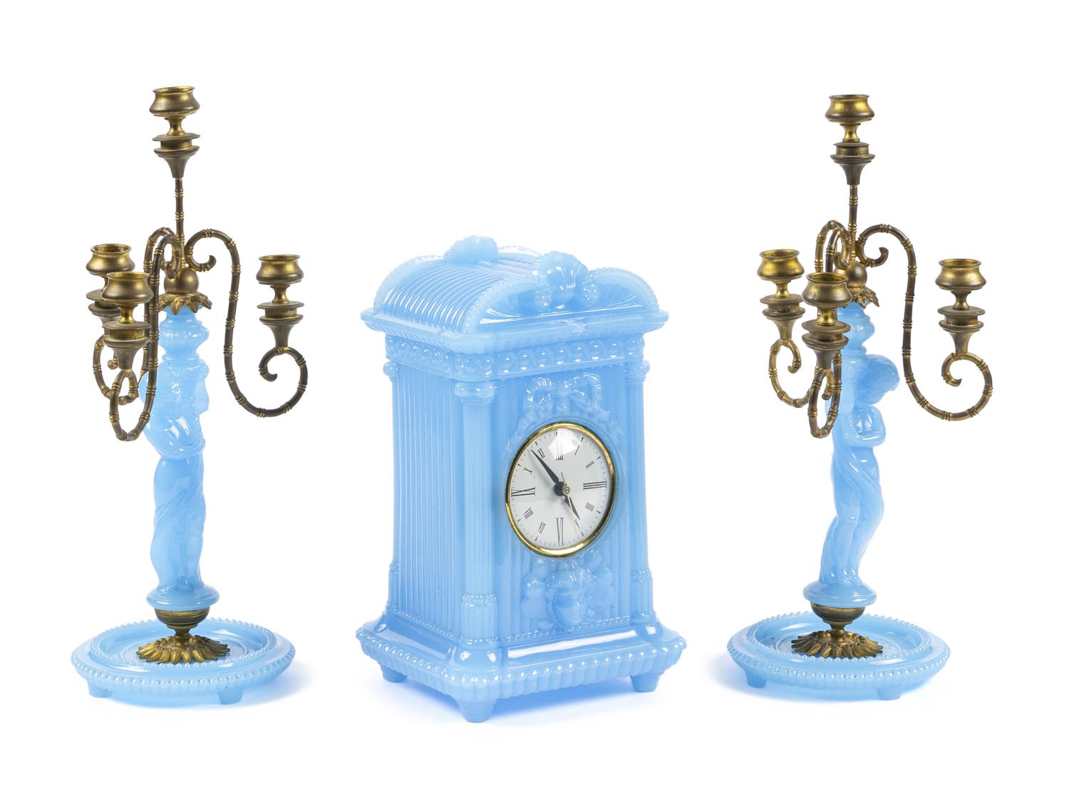 A Continental Blue Opaline Glass Three-Piece Clock Garniture