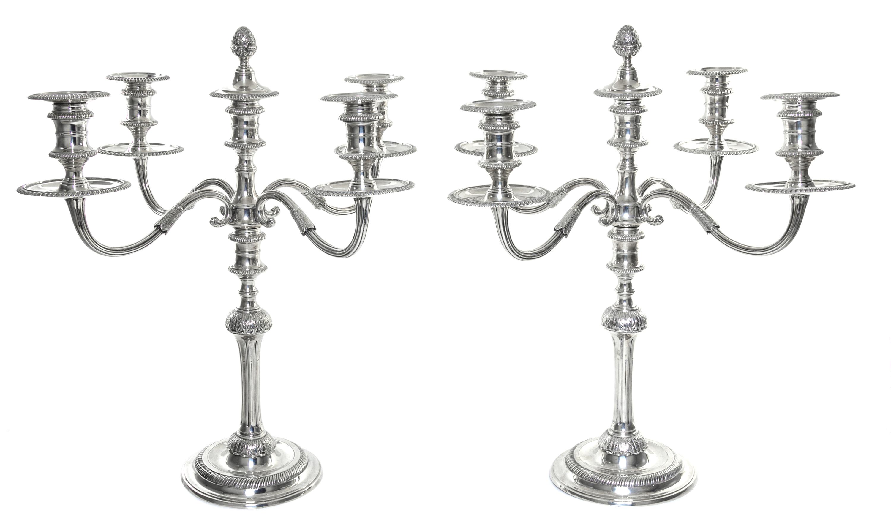A Pair Elizabeth II Silver Five-Light Candelabra, Garrard & Co, London, 1925, each central cup with a removable pine-cone finial surmou