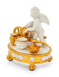 A Paris Porcelain Parcel Gilt Figural Encrier