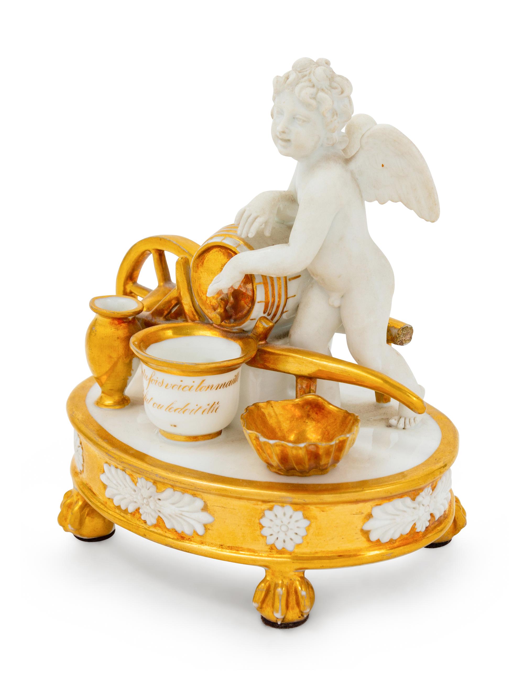 A Paris Porcelain Parcel Gilt Figural Encrier