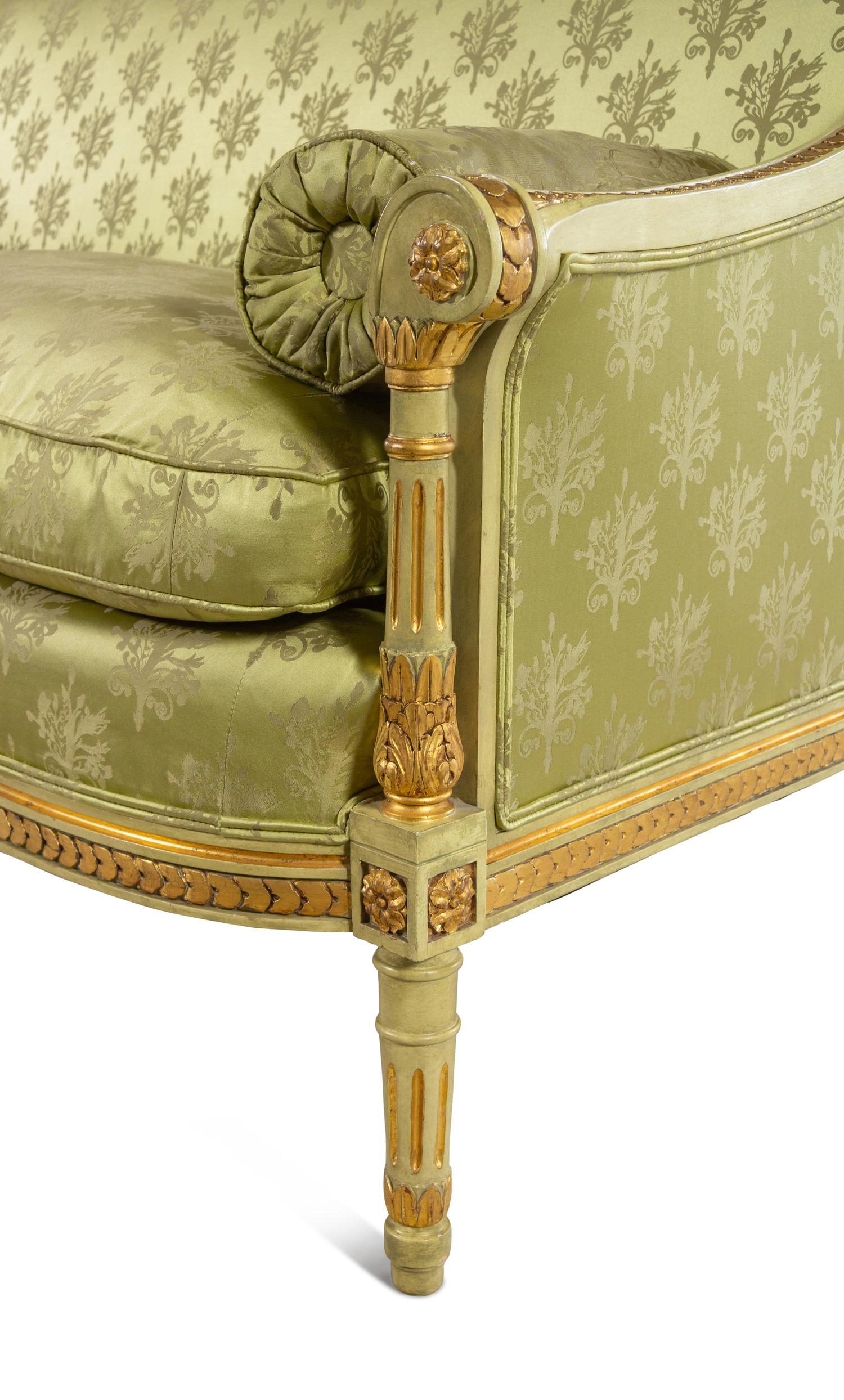 A Louis XVI Style Painted and Parcel Gilt Settee