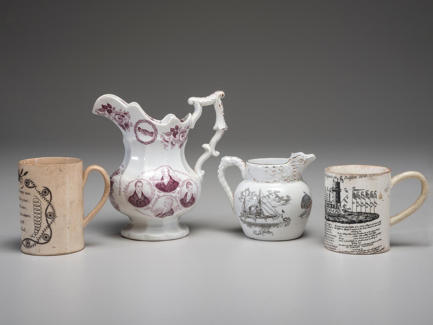 Two Commemorative Creamware Pitchers and Two Ale Mugs