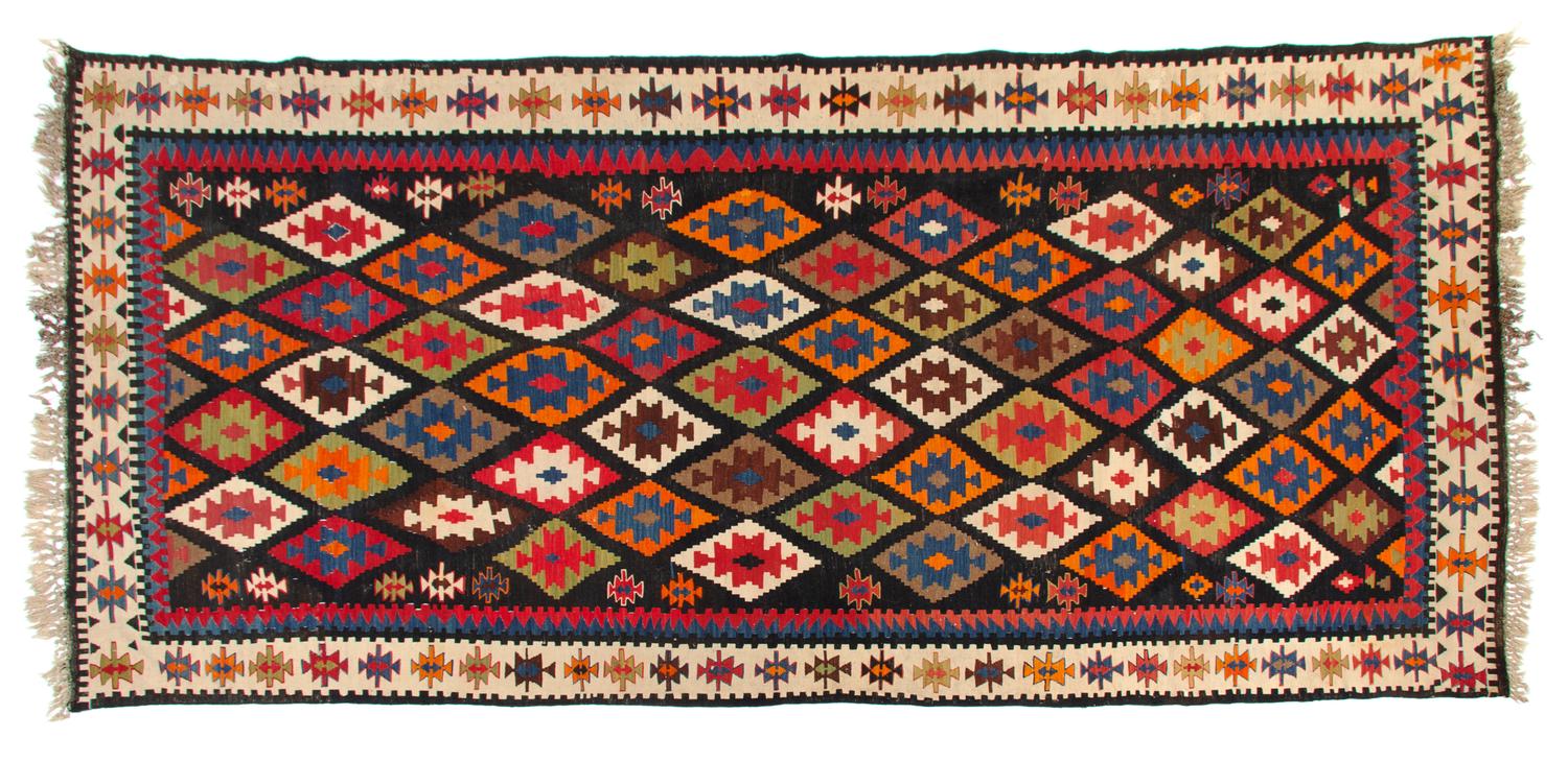 A Kuba Kilim Wool Rug 10 feet 8 inches x 5 feet 4 inches. — CIRCA 1900