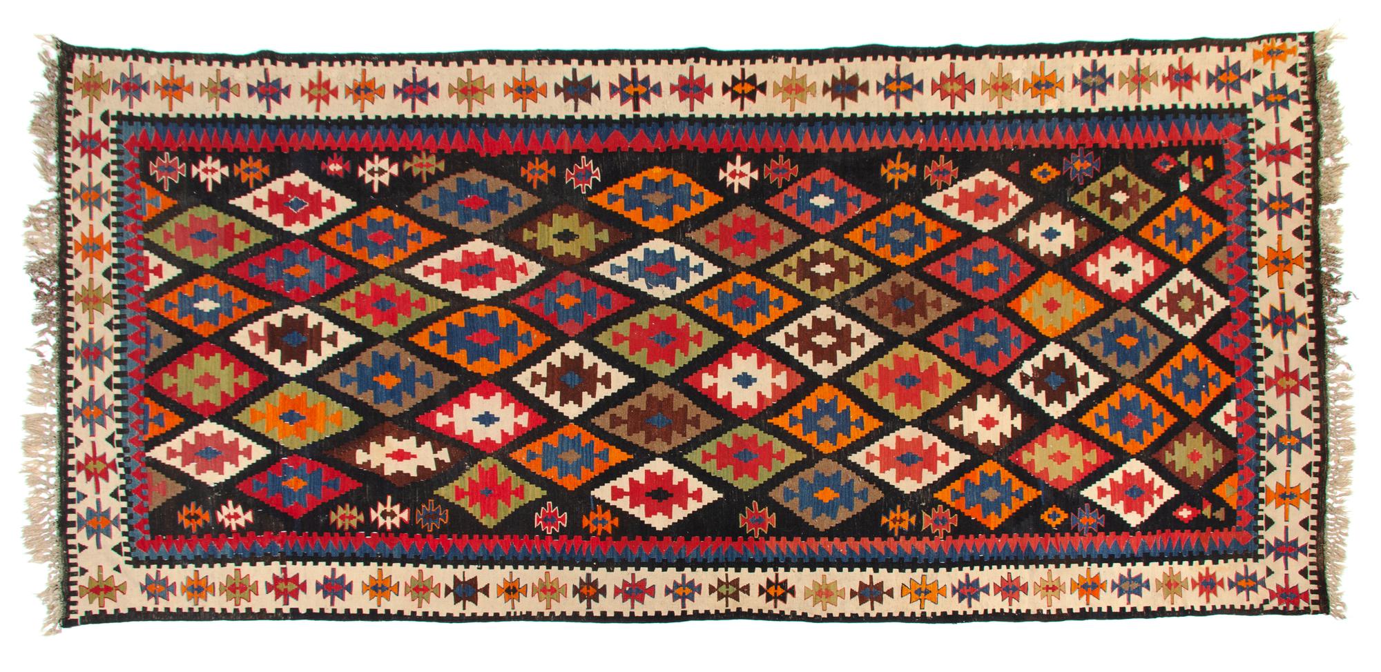 A Kuba Kilim Wool Rug 10 feet 8 inches x 5 feet 4 inches. — CIRCA 1900