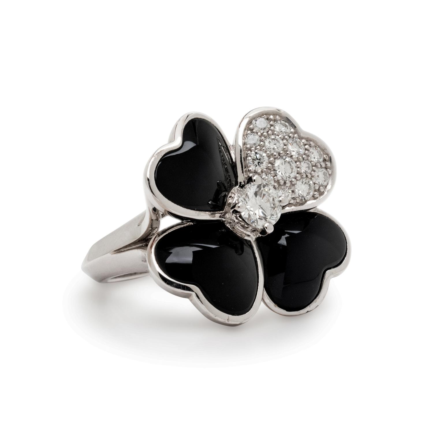 VAN CLEEF & ARPELS, DIAMOND, ONYX AND WHITE GOLD 'COSMOS' RING