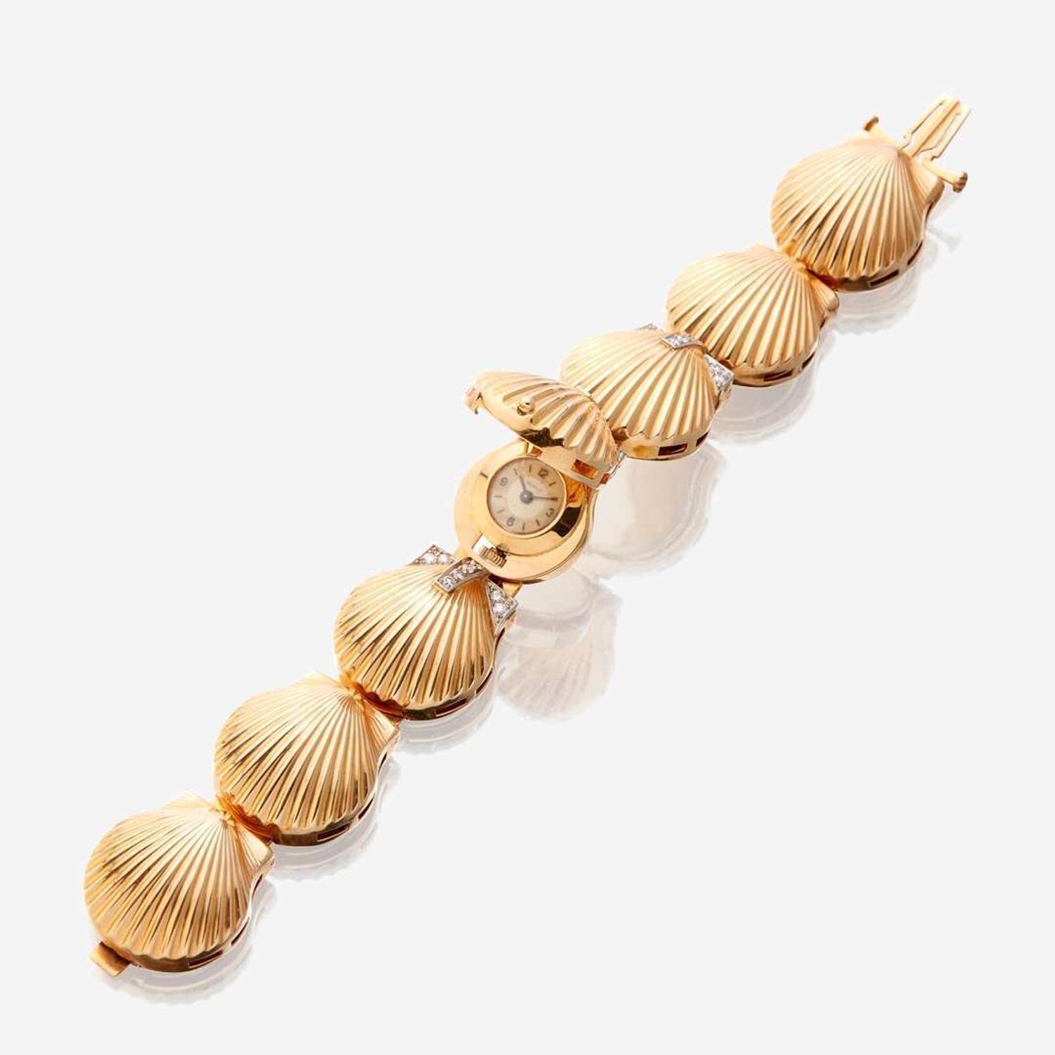 A fourteen karat gold and diamond bracelet watch, J. Schulz