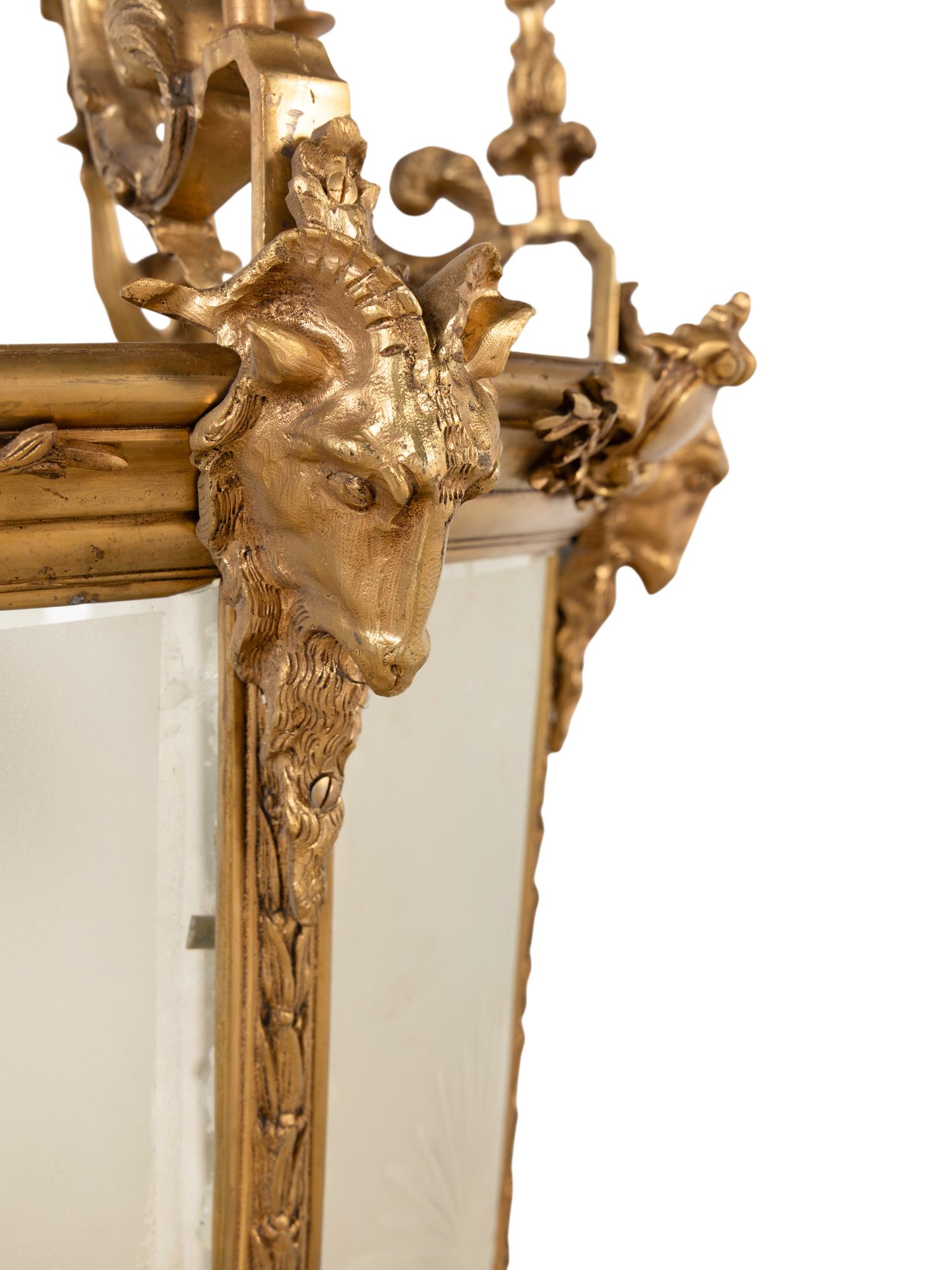A Pair of Louis XVI Style Gilt Bronze and Frosted Glass Hall Lanterns
