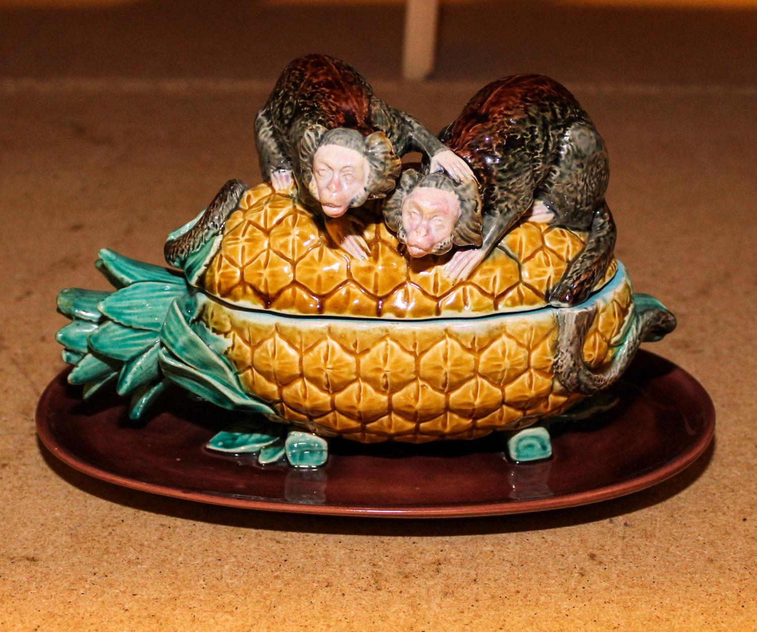 A Majolica Figural Box. Length 9 inches.