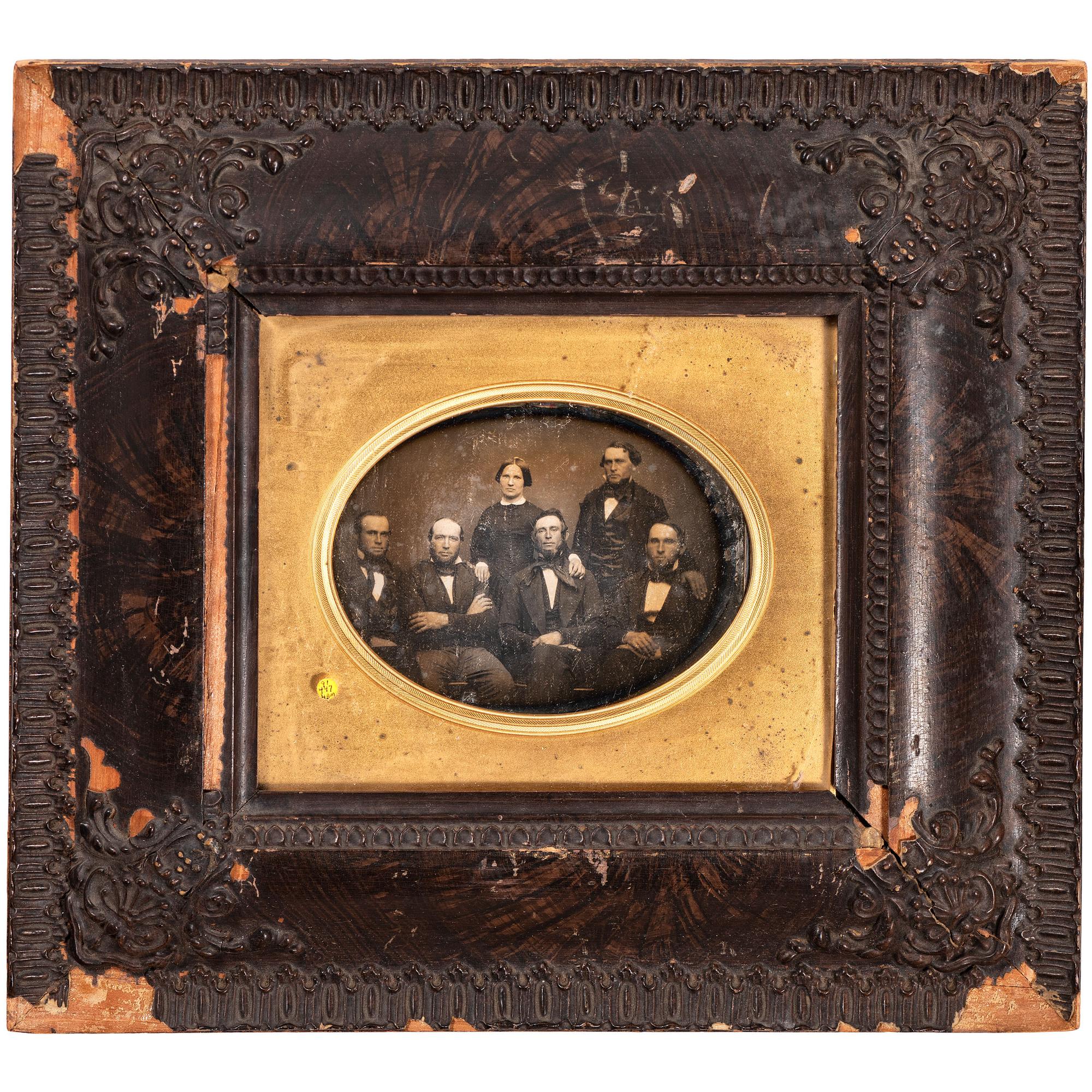 [EARLY PHOTOGRAPHY - PORTRAITURE]. A pair of half plate daguerreotype portraits of families housed in wooden wall frames, comprising: