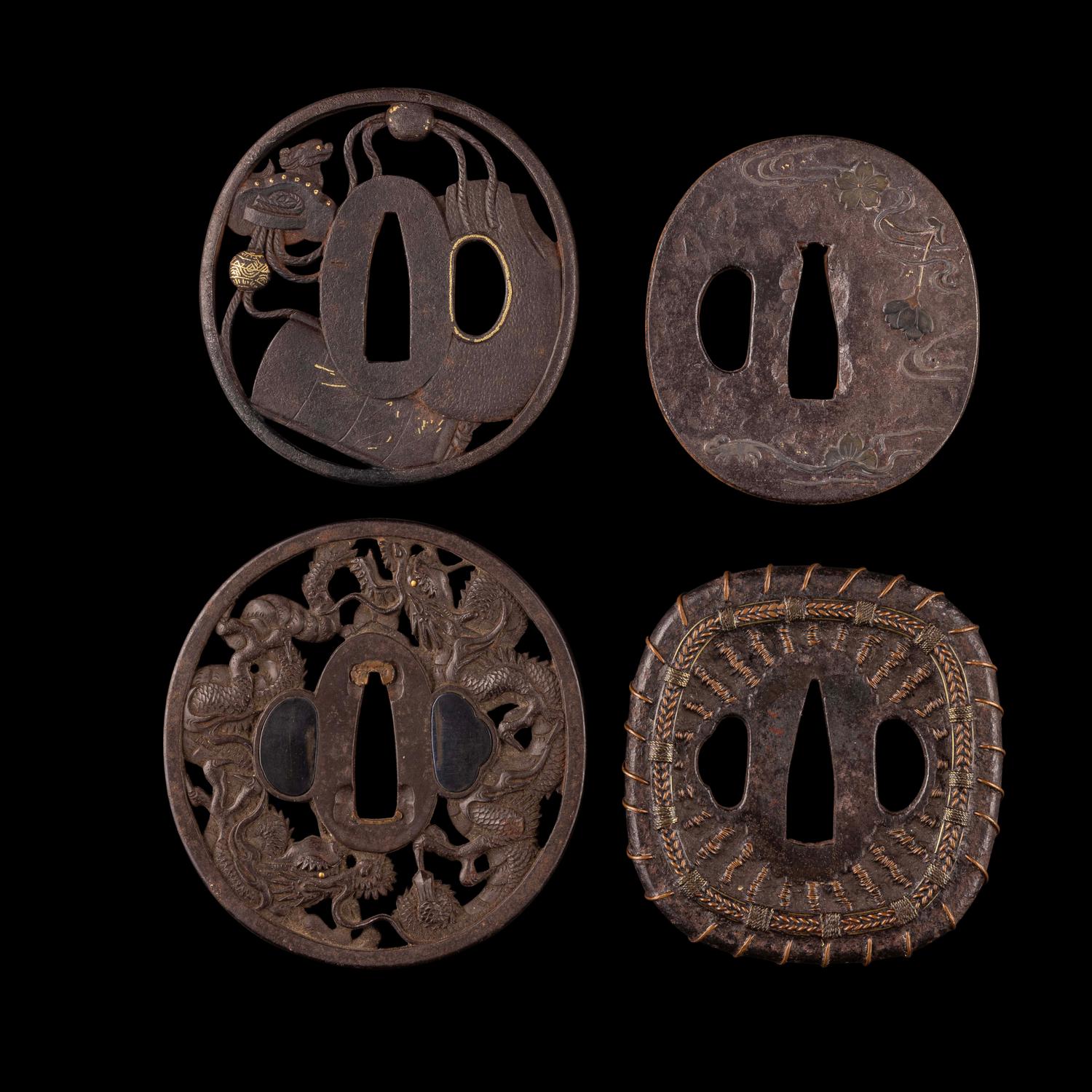 Four Japanese Inlaid Cast Iron Tsuba
