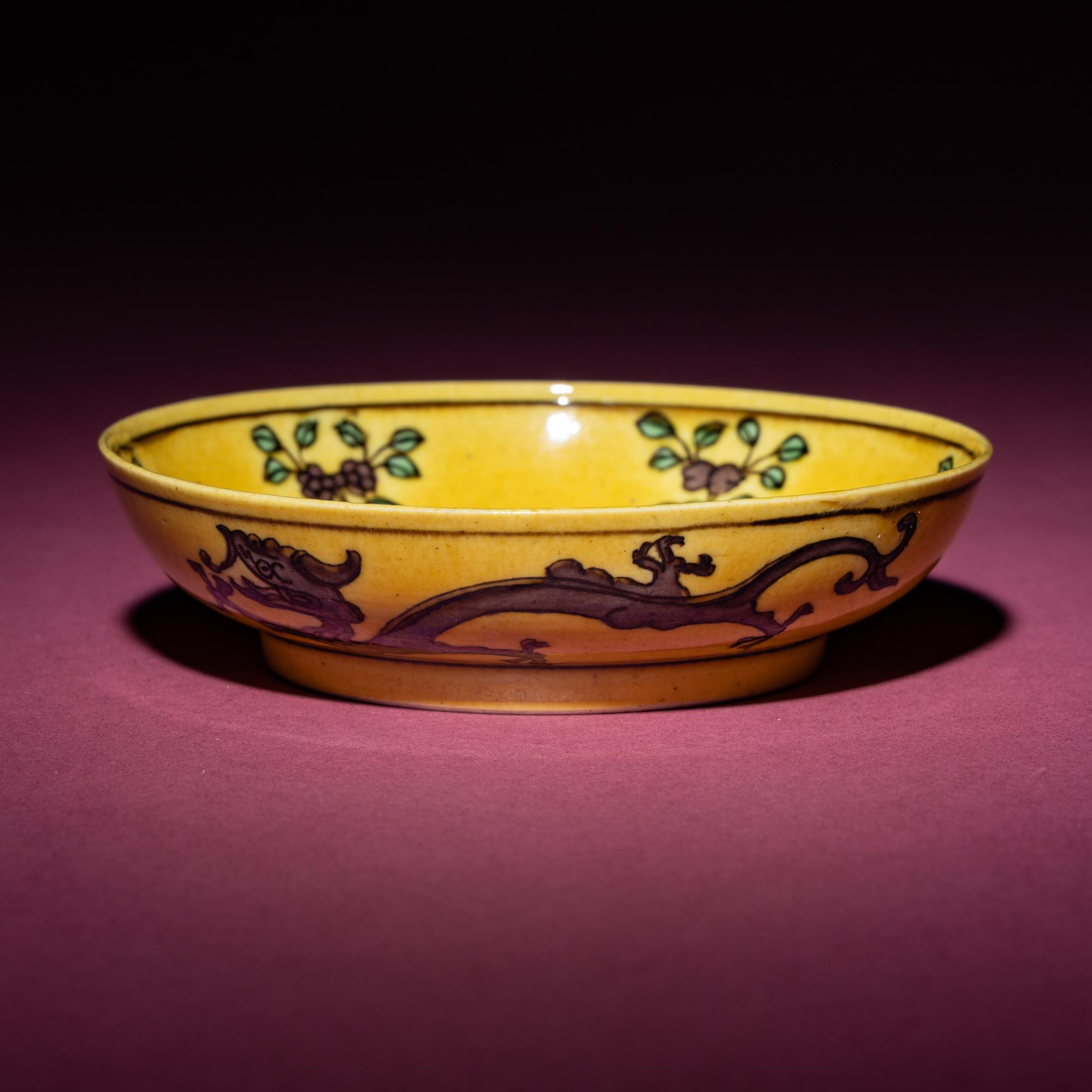 A Small Chinese Yellow Ground Green and Aubergine 'Dragon' Dish, Daoguang Mark and Period — 清道光 黃地紫綠彩雙龍戲珠紋碟