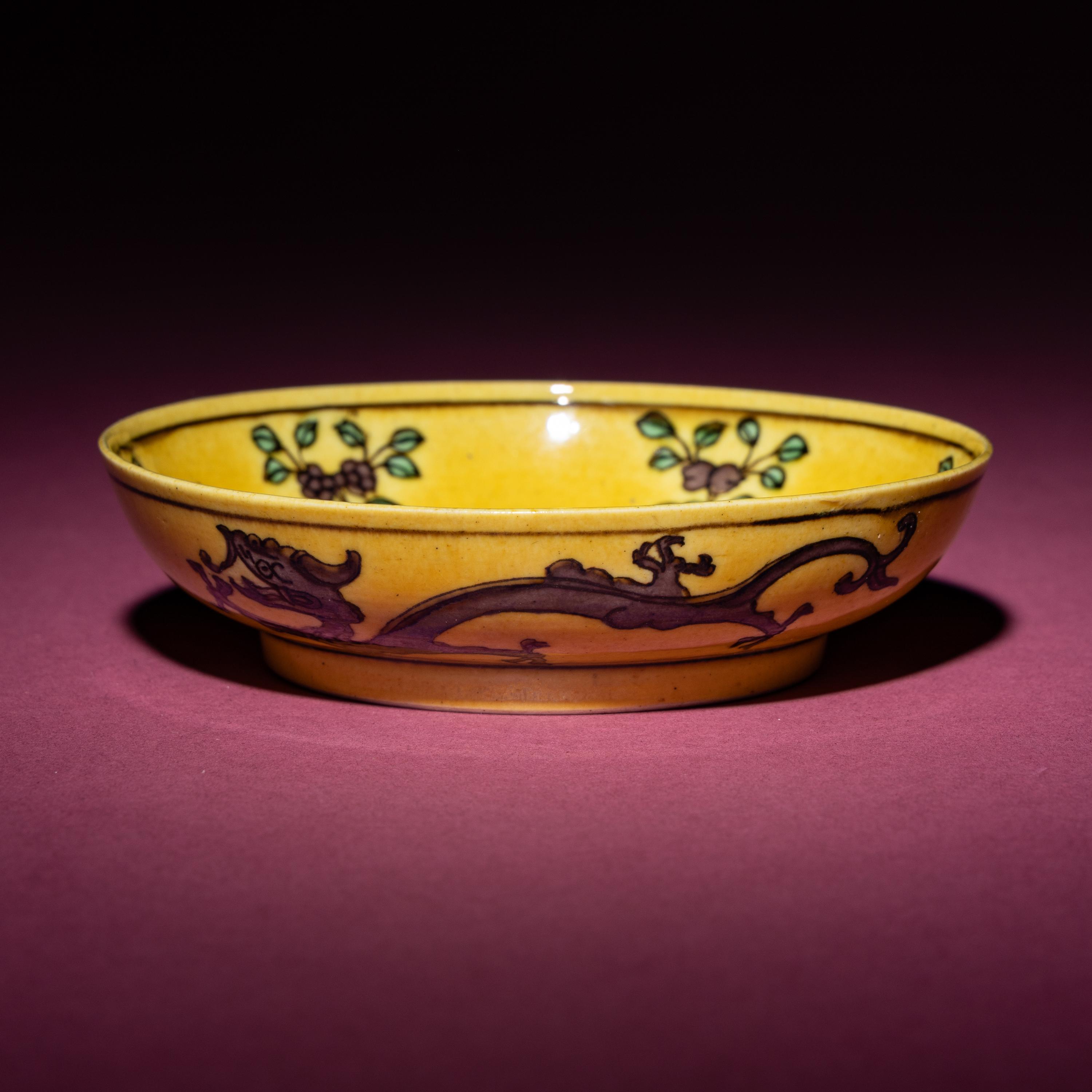 A Small Chinese Yellow Ground Green and Aubergine 'Dragon' Dish, Daoguang Mark and Period — 清道光 黃地紫綠彩雙龍戲珠紋碟