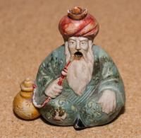 A Ceramic Figure Height 3 1/4 inches.