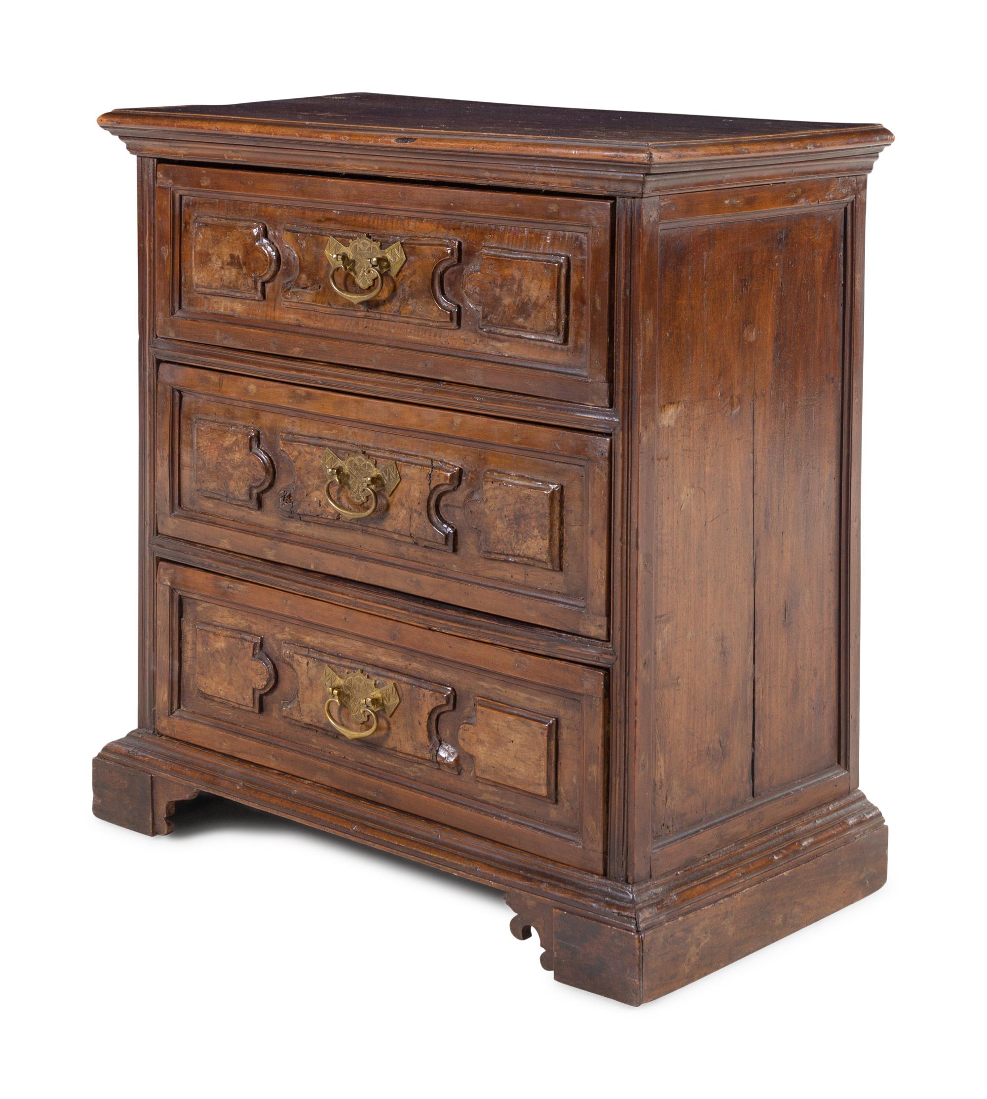 An Italian Walnut Chest of Drawers