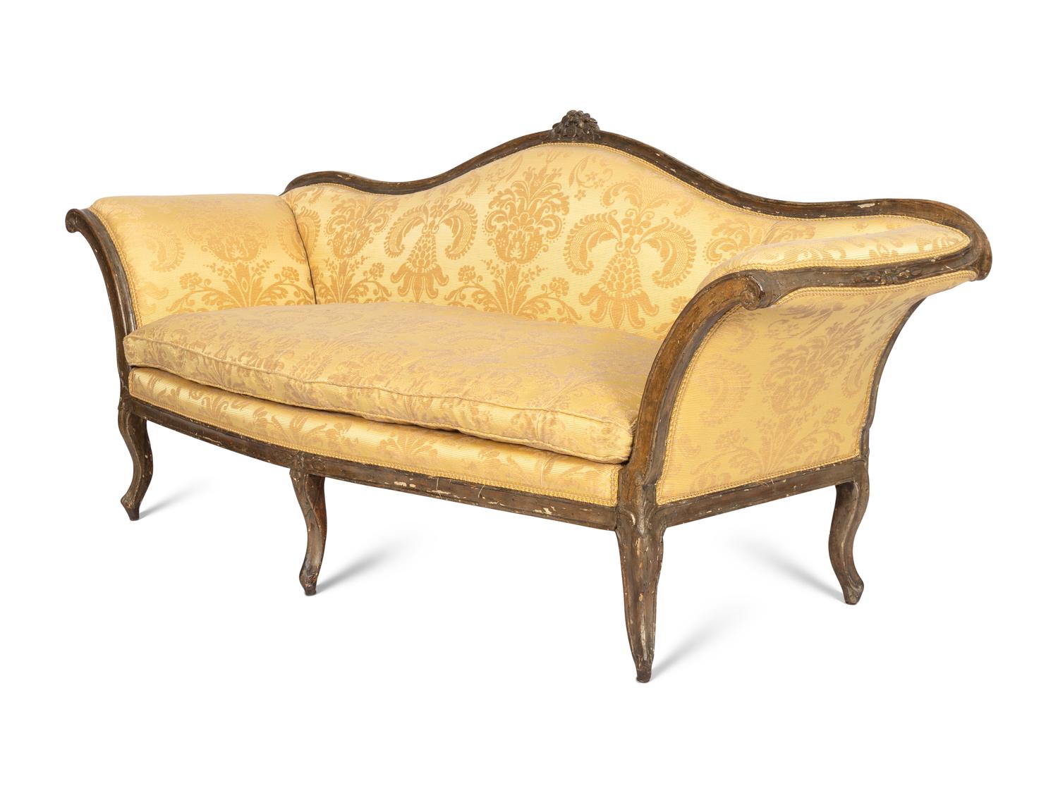 An Italian Rococo Silvered and Gilt Walnut Sofa