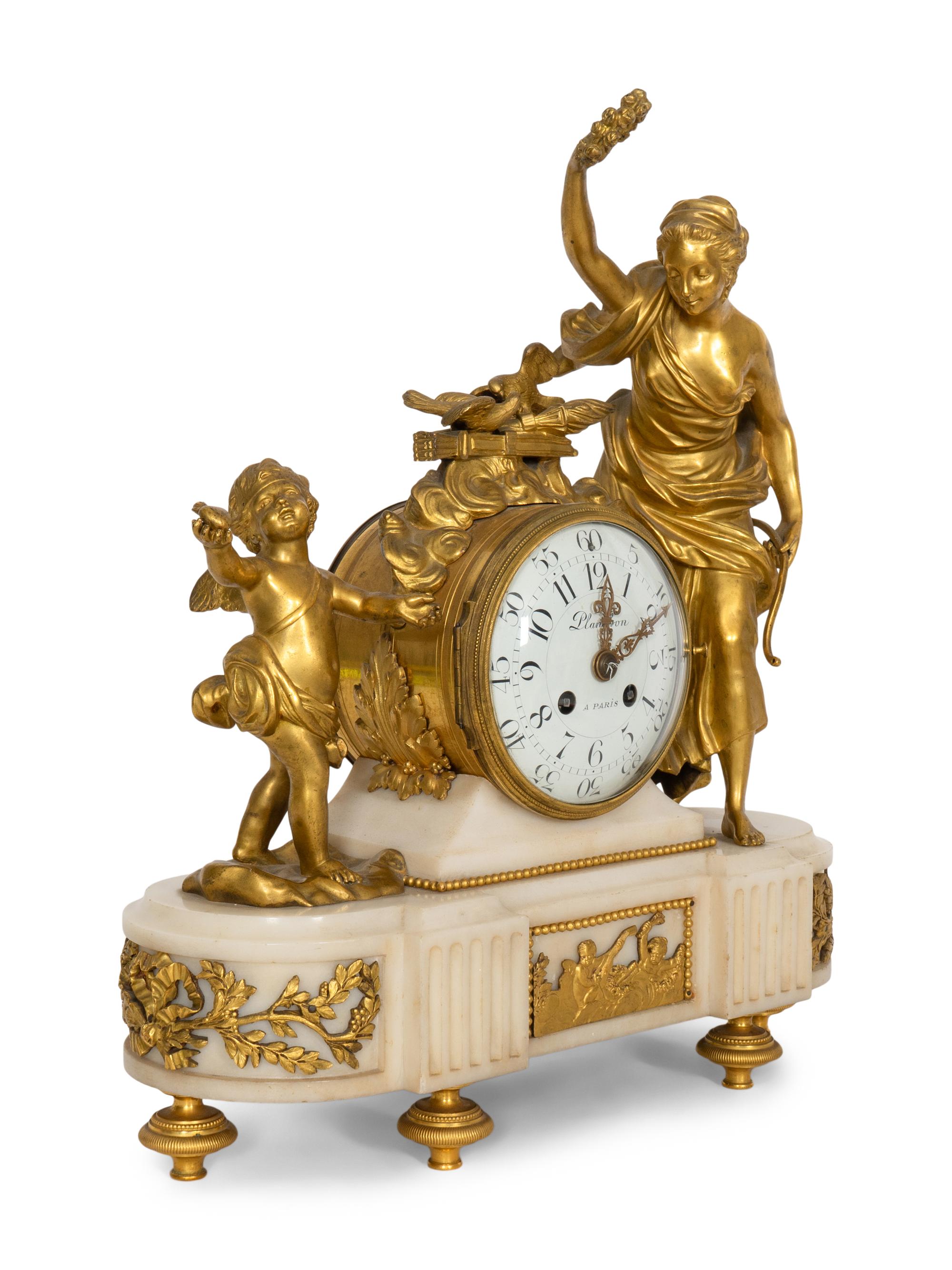 A Napoleon III Marble and Gilt Bronze Mounted Mantel Clock