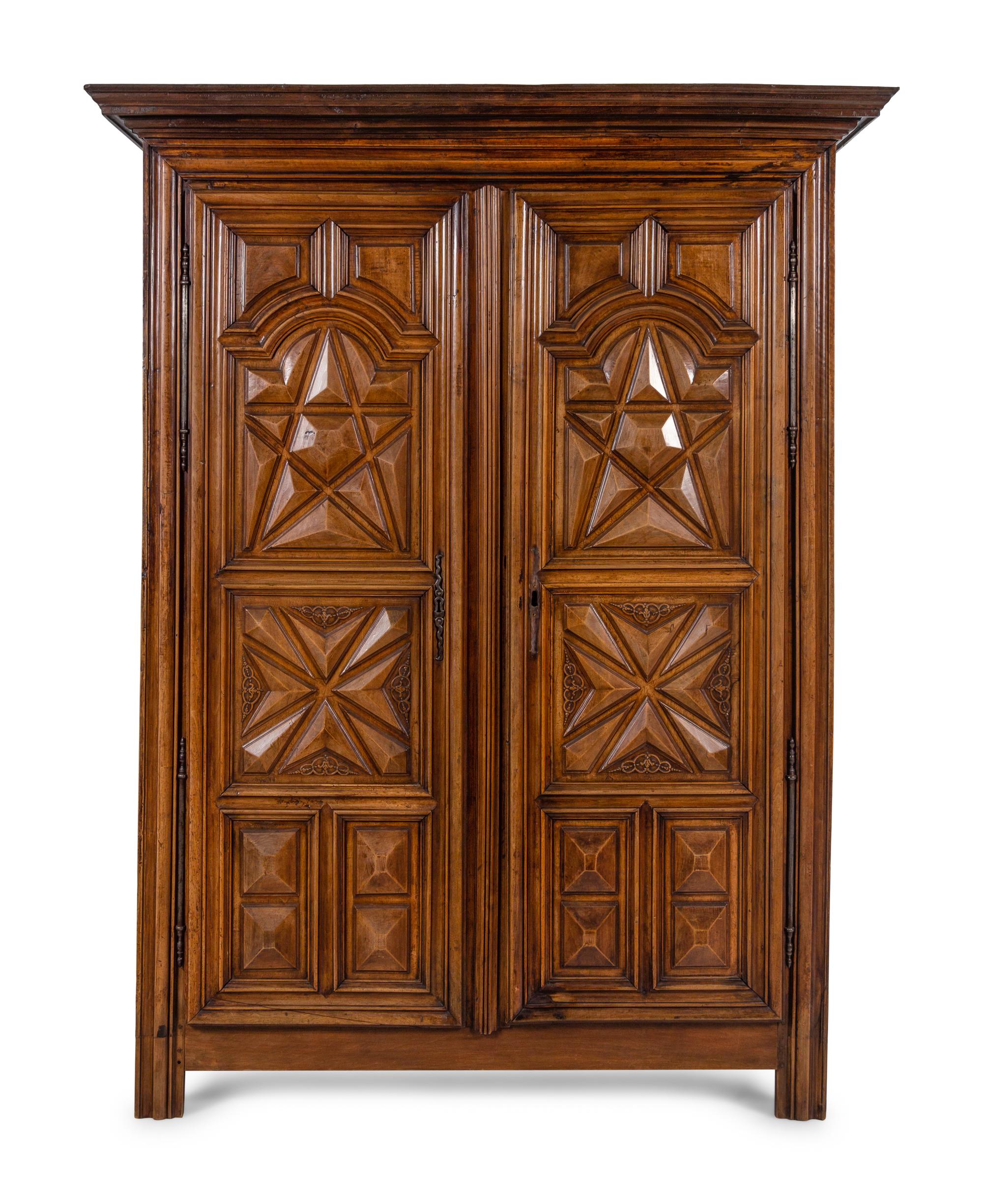 A Louis XIII Style Carved Walnut Armoire