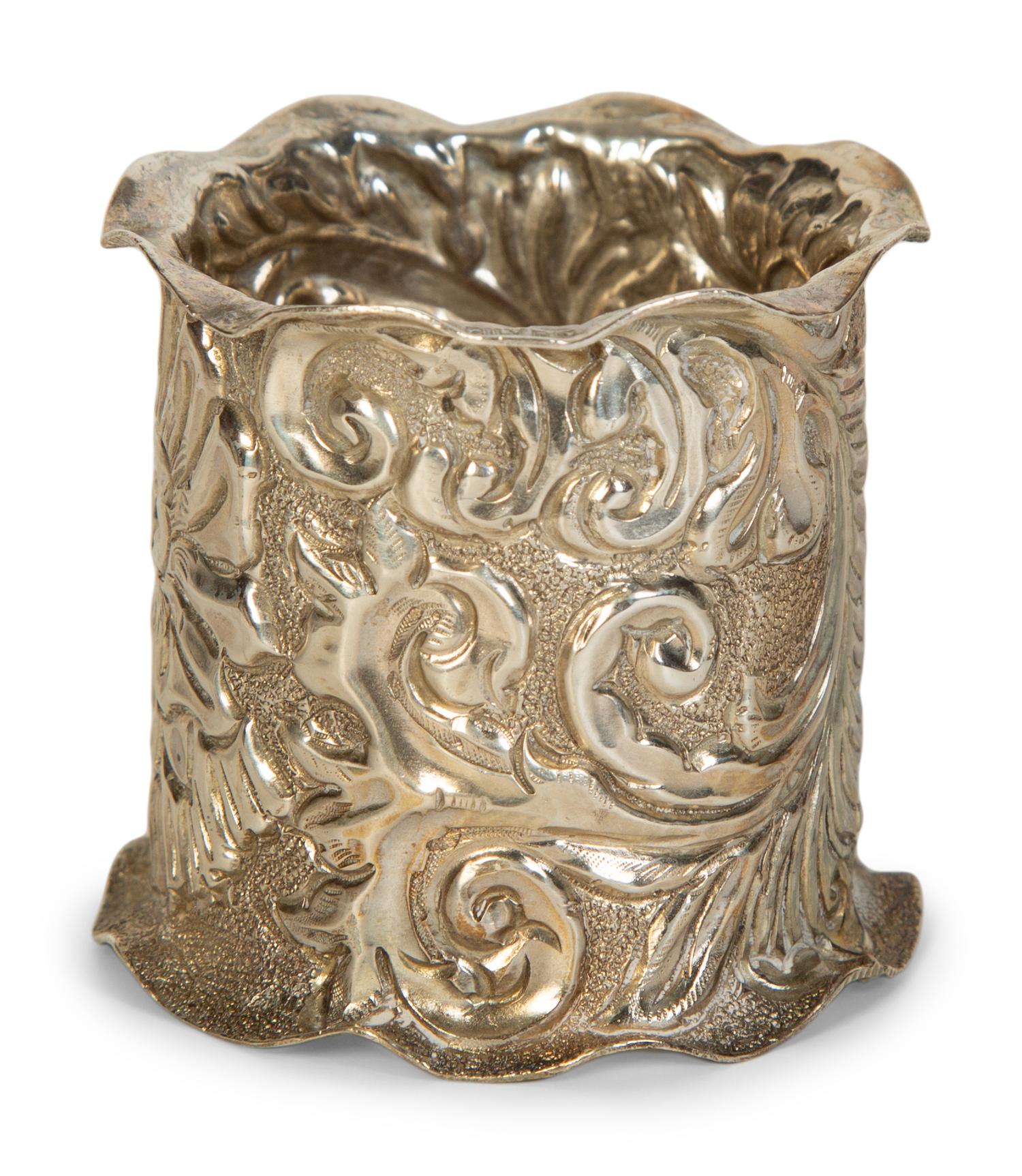 Twelve American Repoussé Silver Napkin Rings
