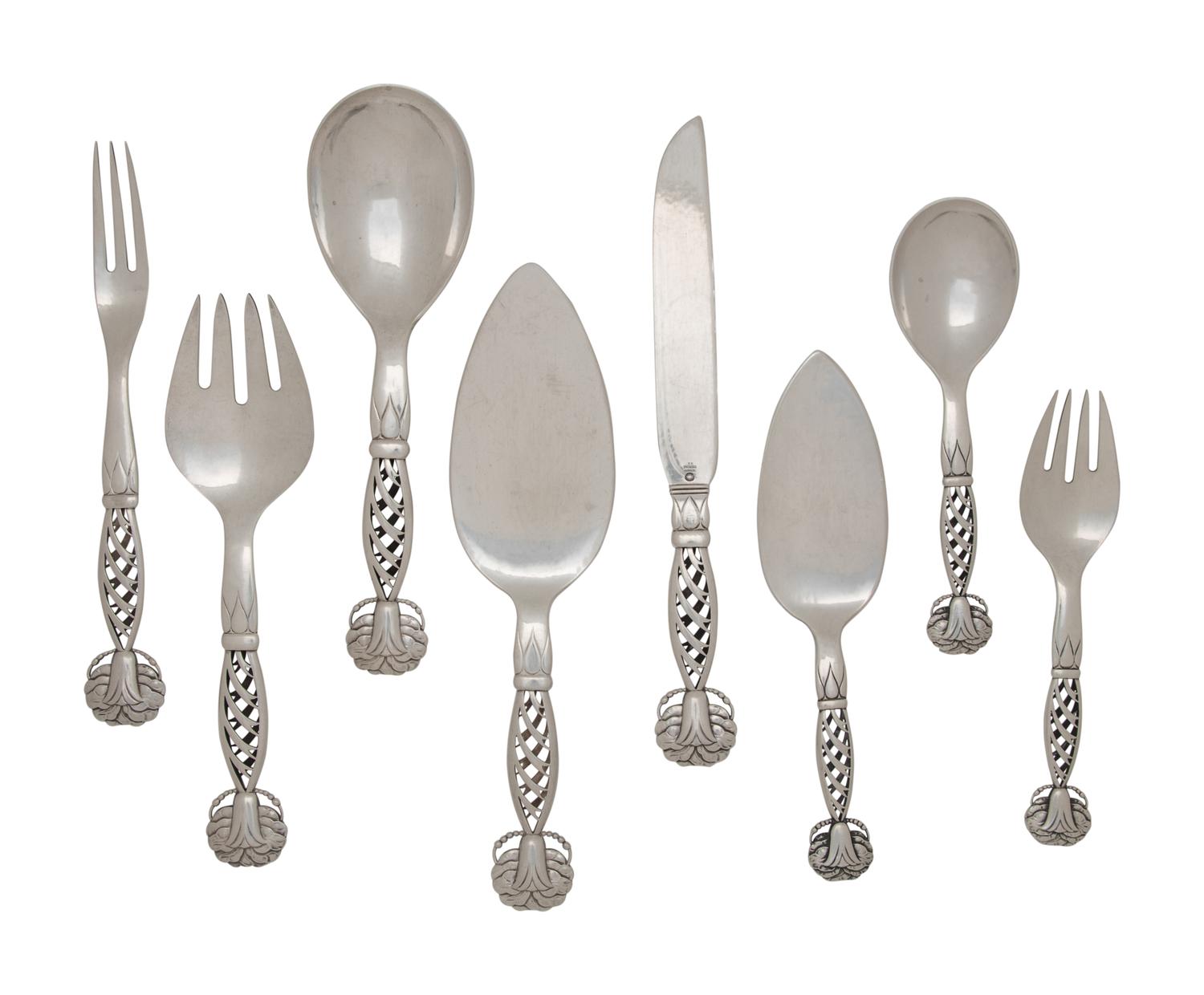 A Group of Eight Georg Jensen Silver Ornamental Serving Articles