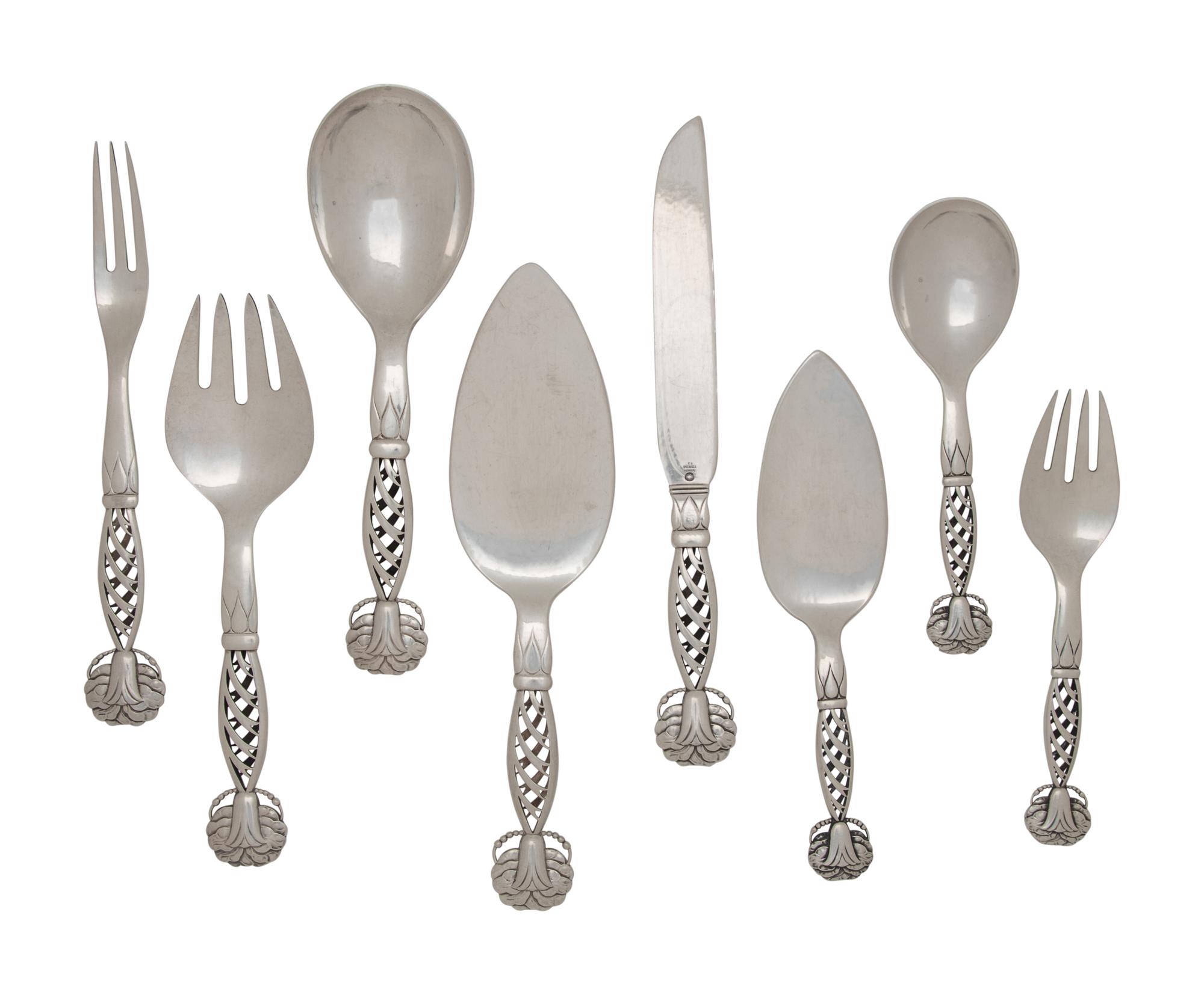 A Group of Eight Georg Jensen Silver Ornamental Serving Articles