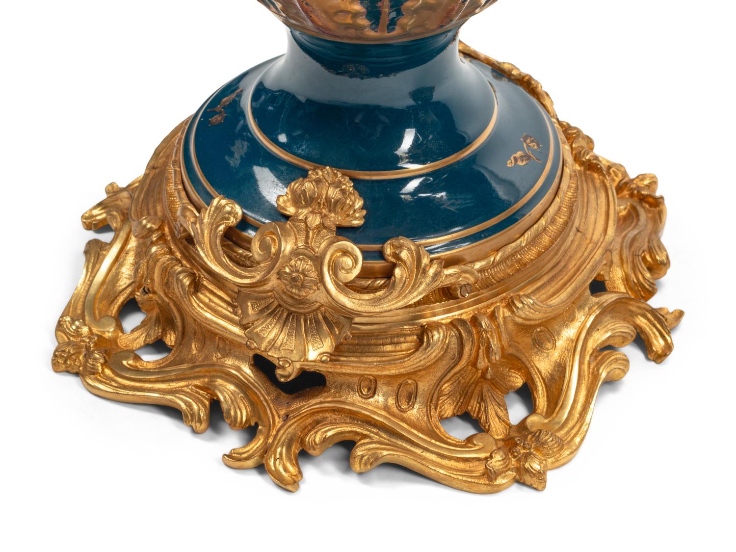 A Pair of Large Continental Gilt Bronze and Porcelain Five-Light Candelabra