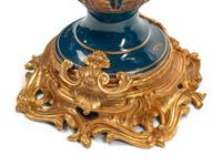 A Pair of Large Continental Gilt Bronze and Porcelain Five-Light Candelabra