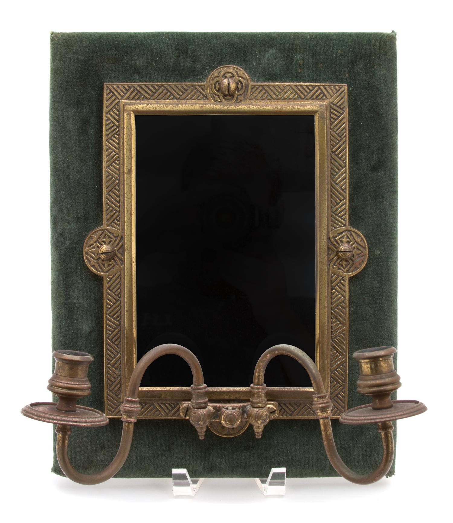 An Ebonized and Gilt Metal Mounted and Mirrored Two-Light Wall Sconce Height 14 x width 11 x depth 6 1/2 inches. — 20TH CENTURY