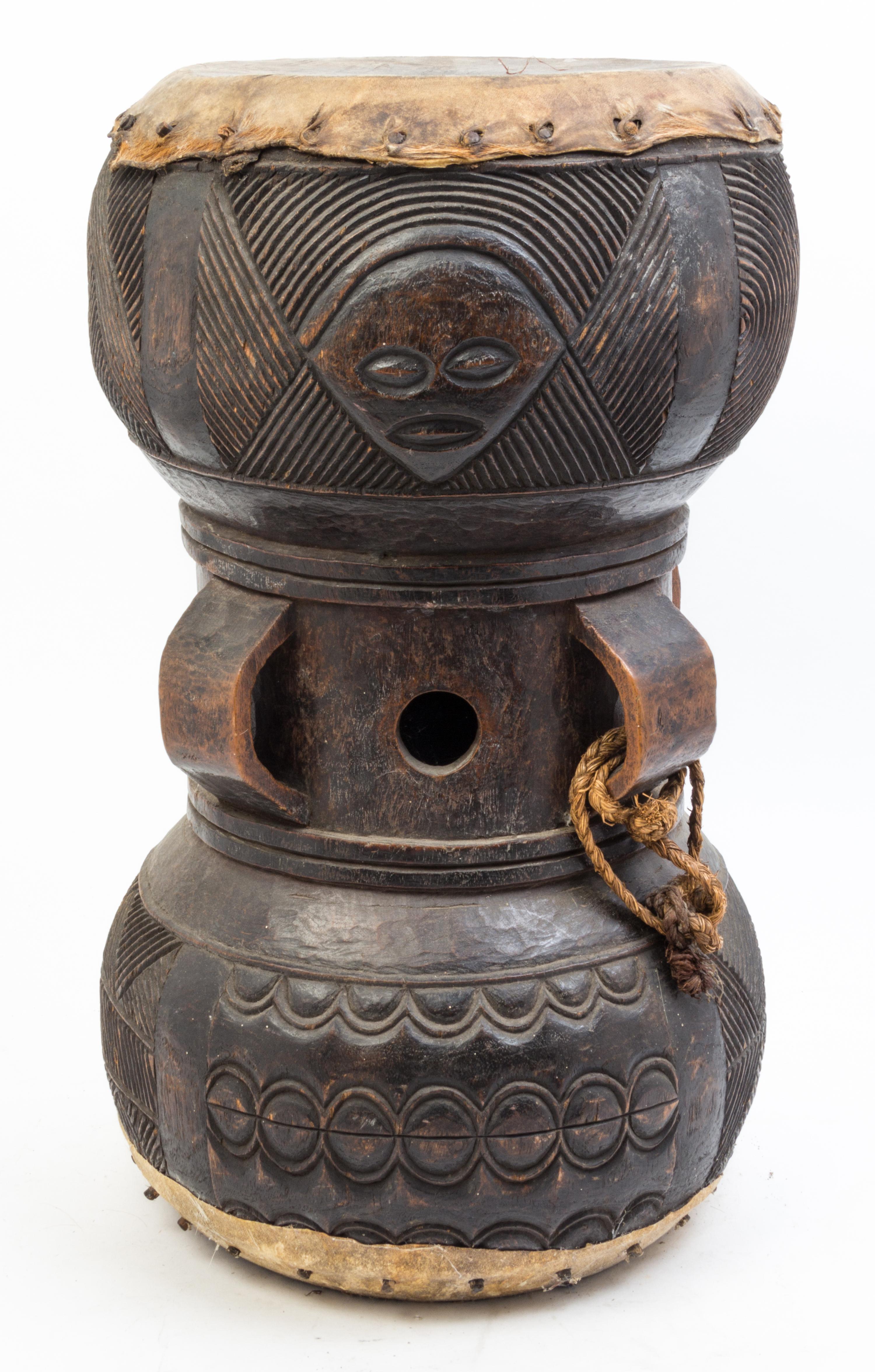 A Carved Wood Drum Height 20 inches.