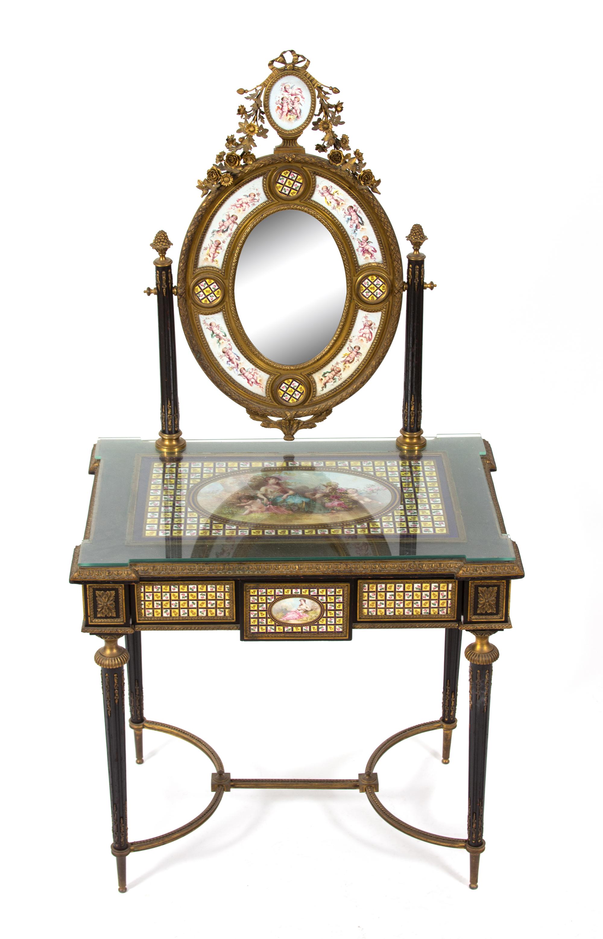 A Napoleon III Enamel and Gilt Bronze Mounted Dressing Table with Porcelain Inserts Height 60 x width 31 x depth 21 inches. — MID-19TH CENTURY
