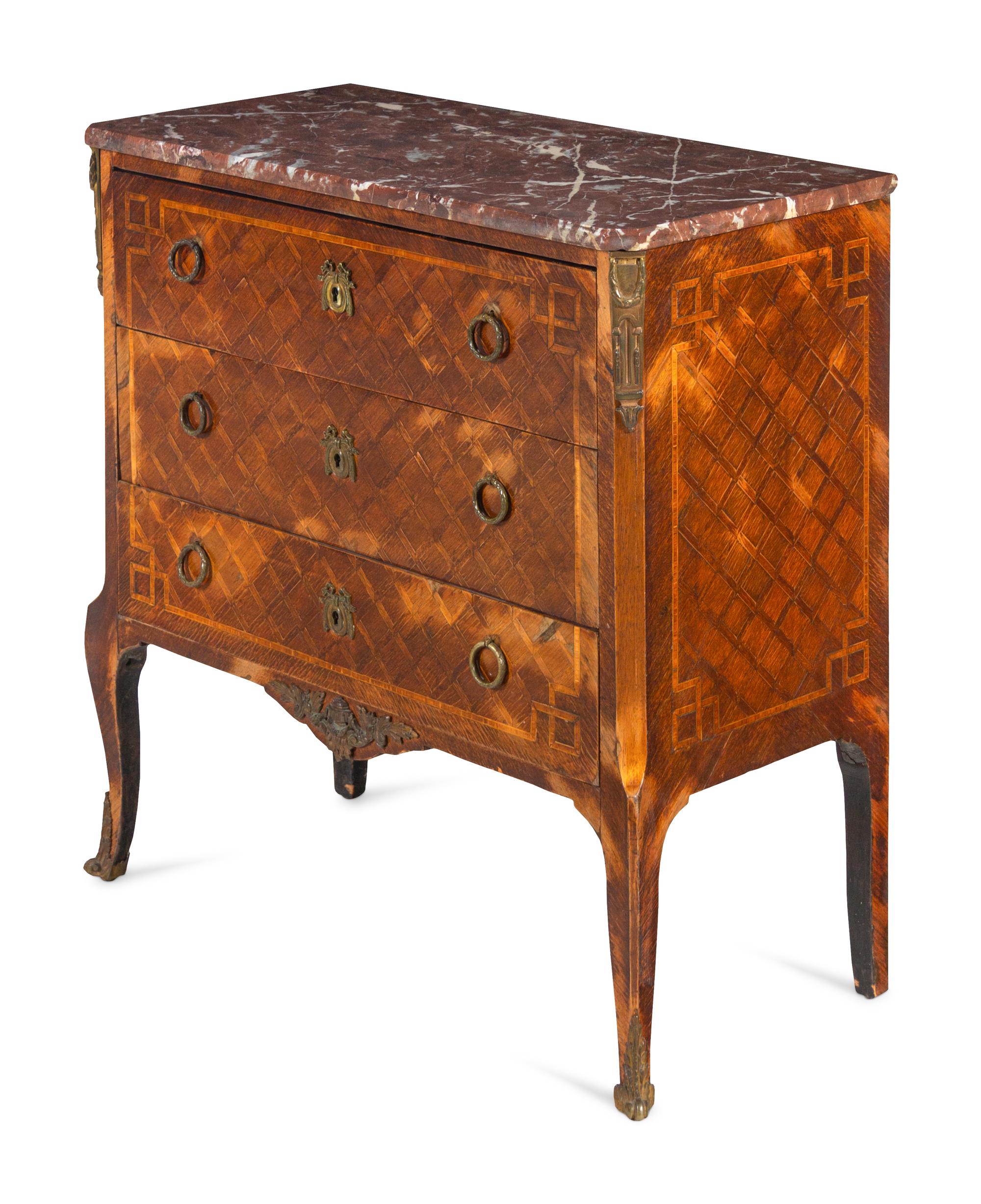 A Louis XV/XVI Transitional Style Gilt Metal Mounted Parquetry Marble Top Commode