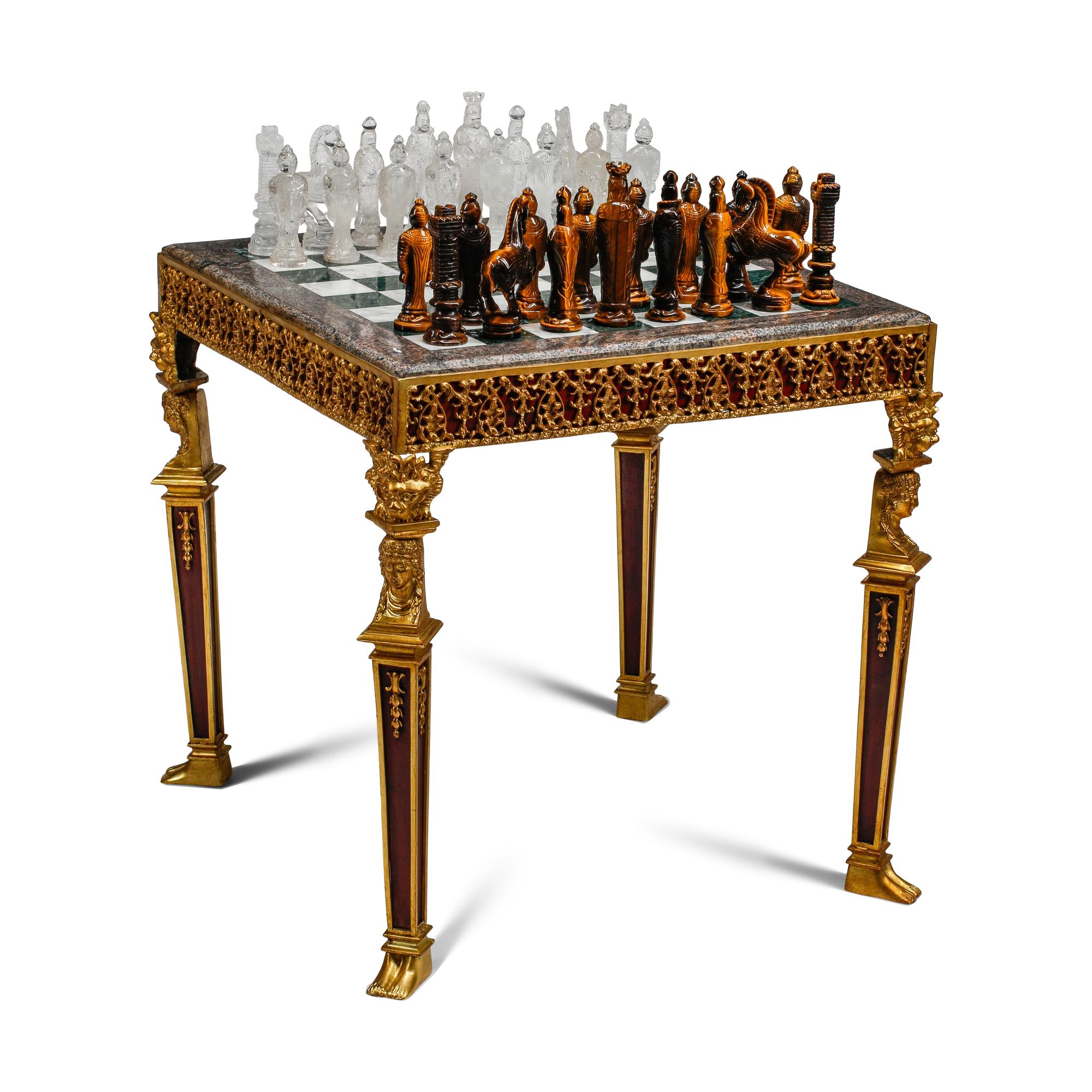 An Empire Style Gilt Bronze Mounted Mahogany and Marble-Top Game Table with a Rock Crystal and Tiger's Eye Chess Set