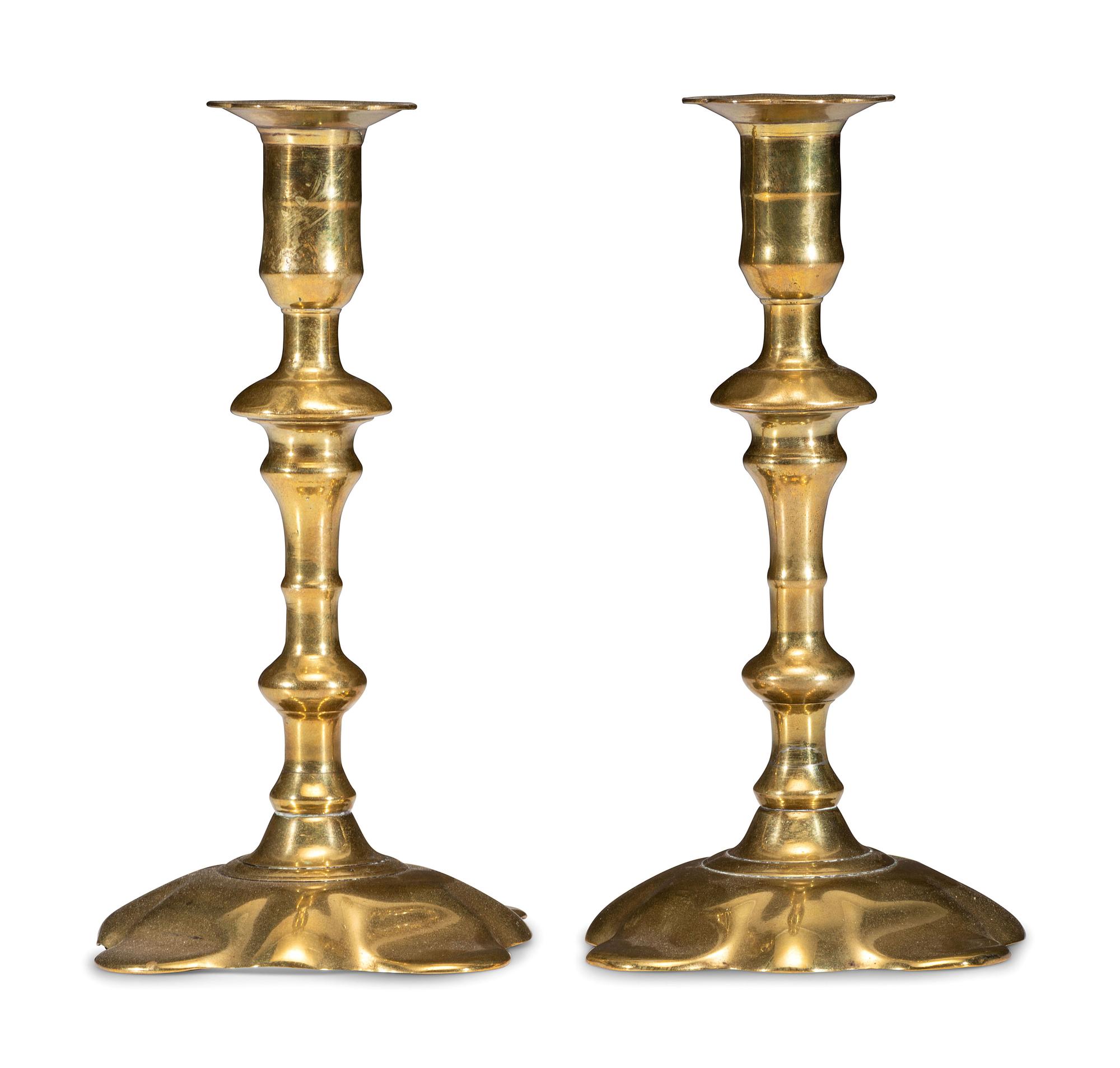 A Pair of Queen Anne Brass Petal Base Candlesticks