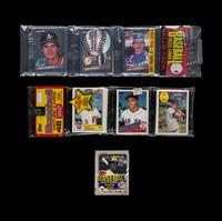 A Collection of 1980s Unopened Baseball Card Packs with Notable Rookie Cards Visible