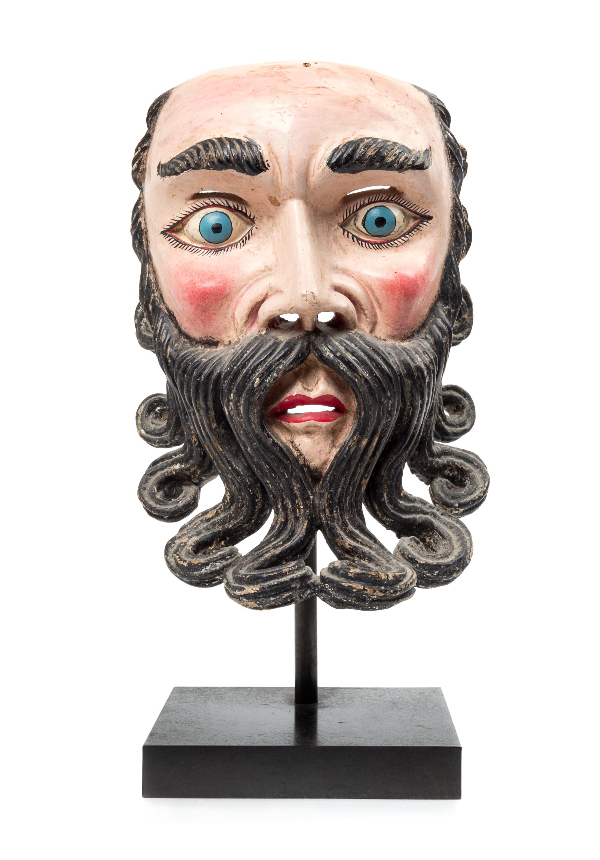 A Mexican Polychromed Wood Mask Height 11 1/2 inches.