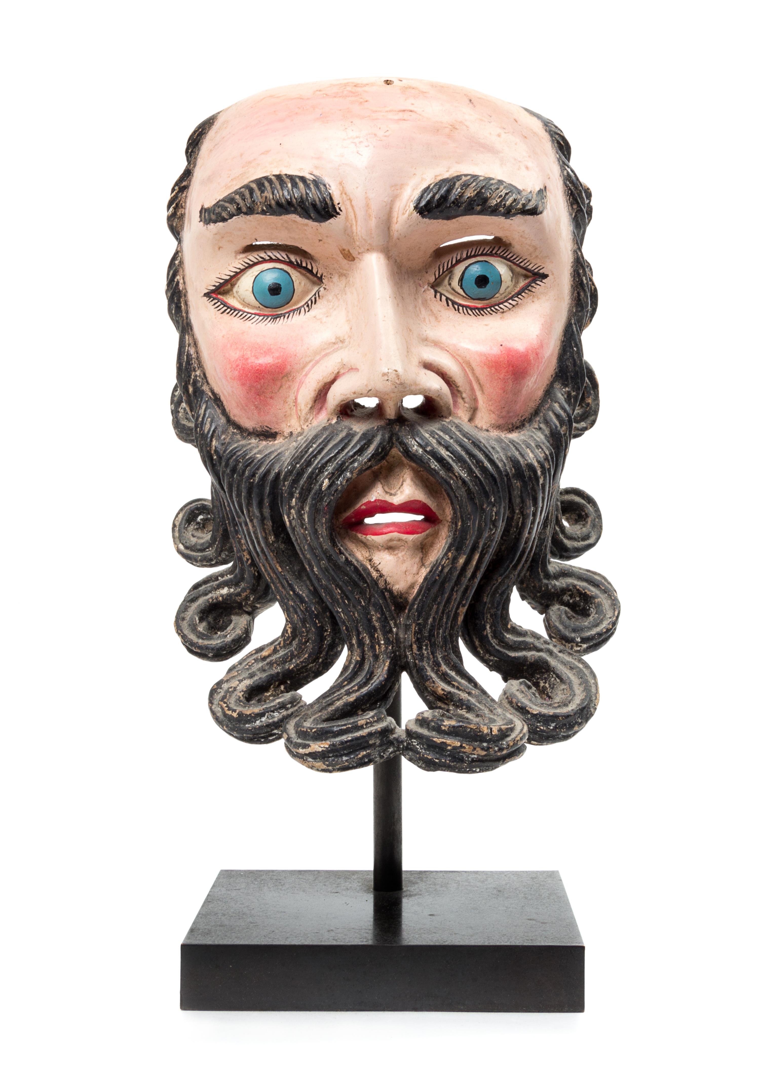 A Mexican Polychromed Wood Mask Height 11 1/2 inches.