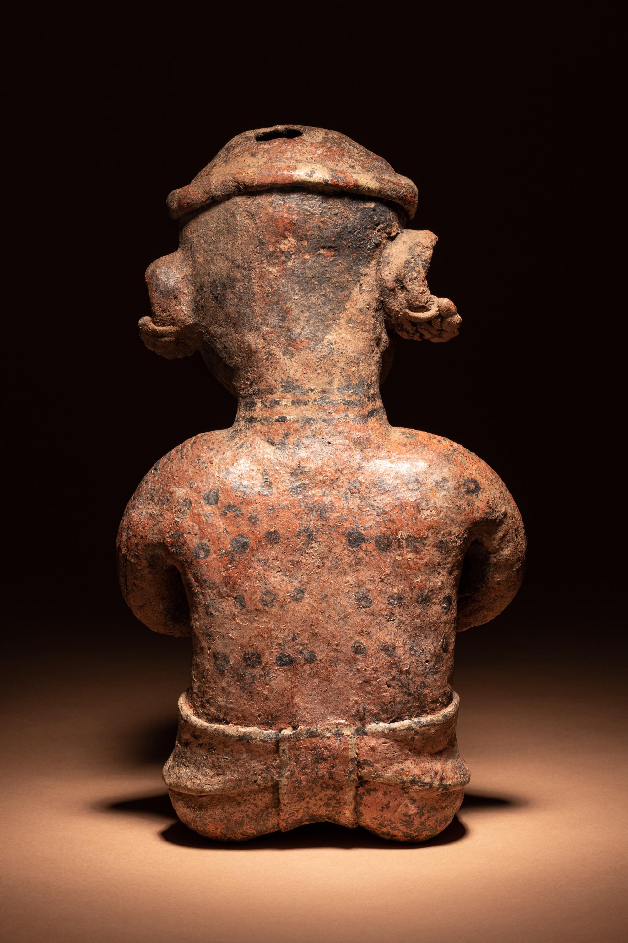 A Nayarit Seated Male Figure