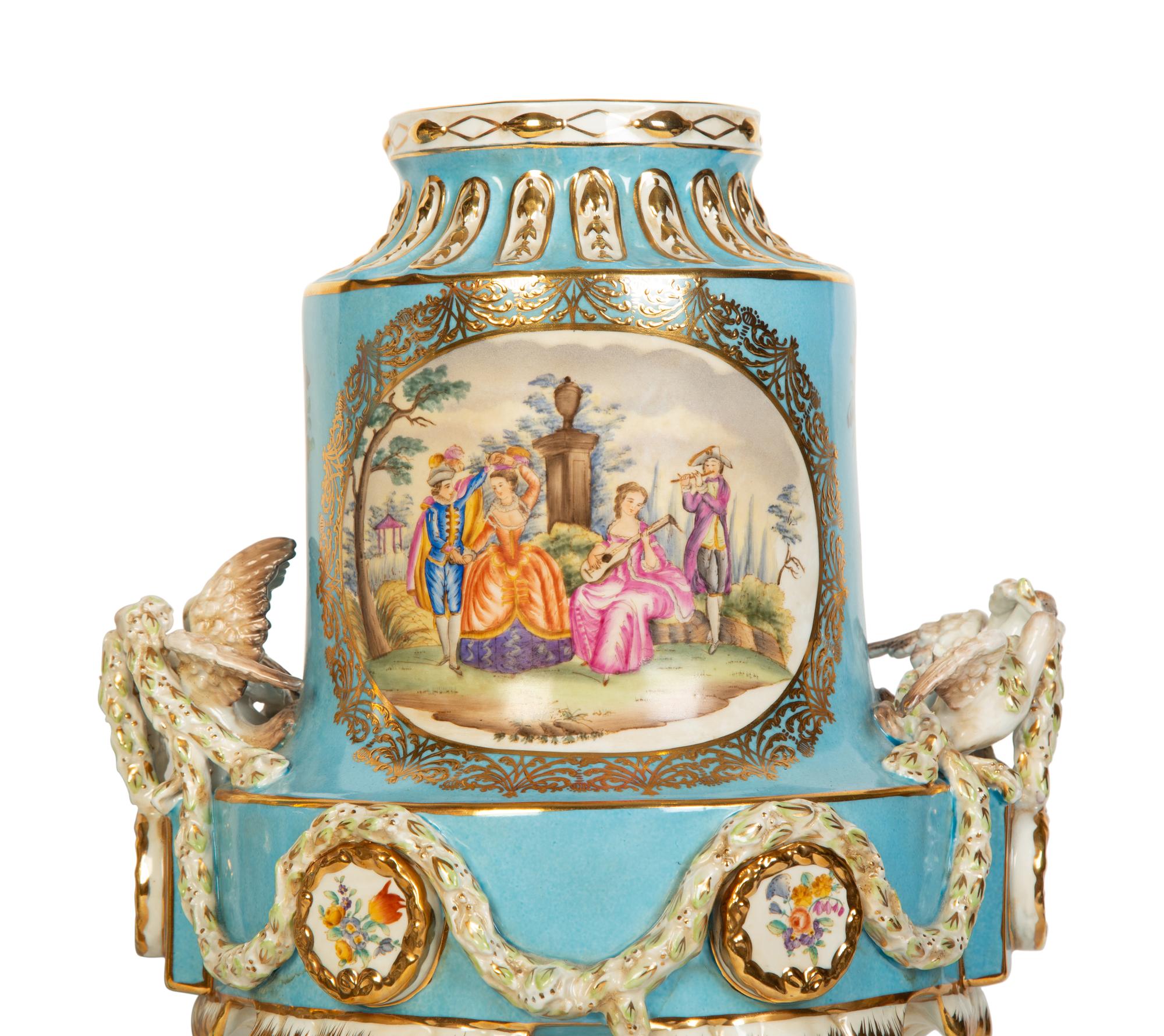 A Pair of Sèvres Style Porcelain Urns