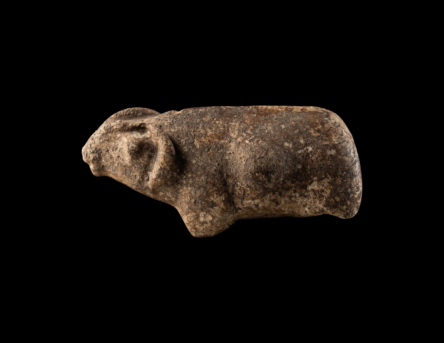 A Near Eastern Marble Figure of a Pregnant Mouflon