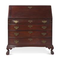 A Chippendale Carved Mahogany Oxbow Slant-Front Desk