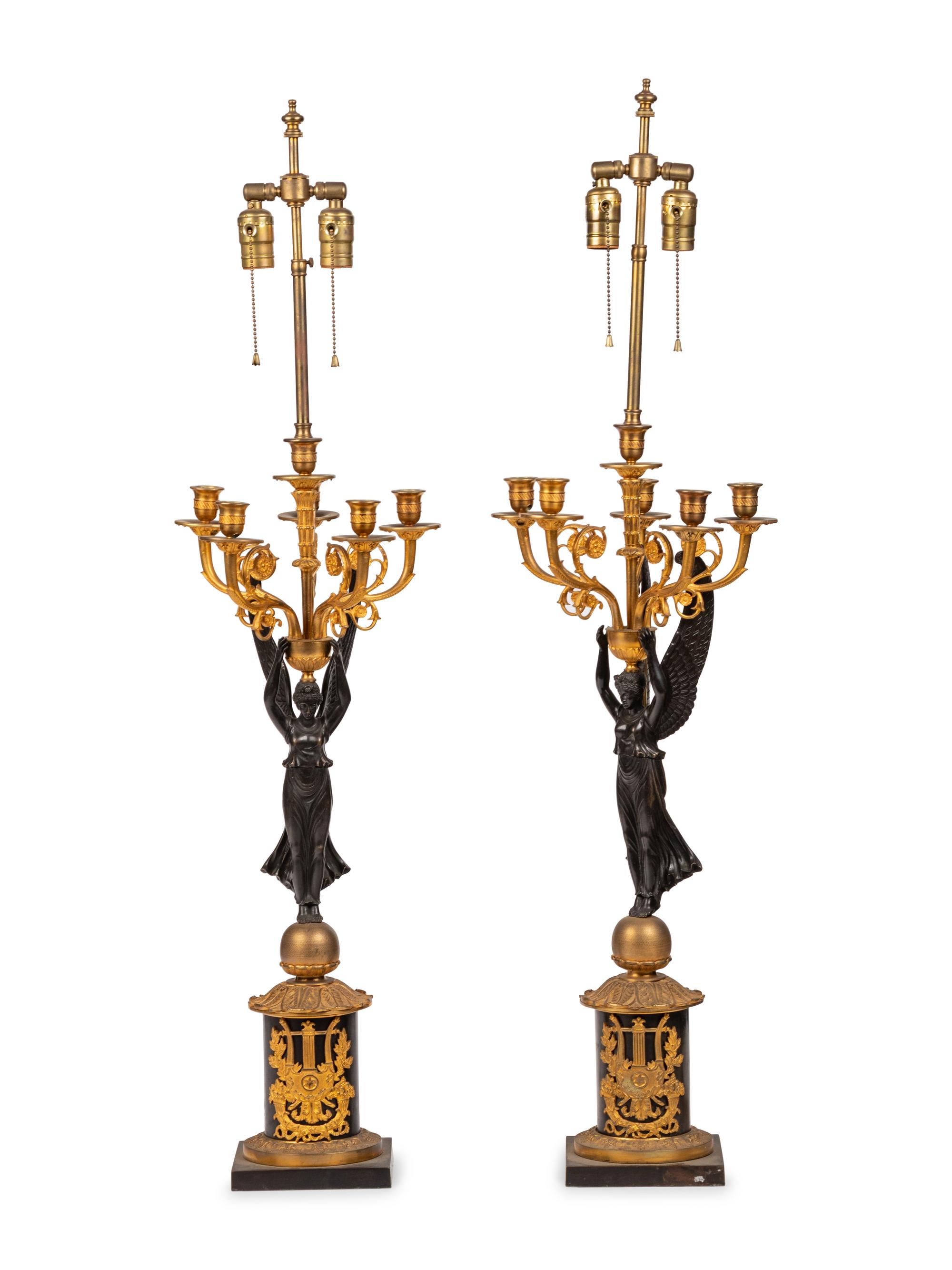 A Pair of Empire Style Gilt and Patinated Bronze Candelabra Mounted as Lamps