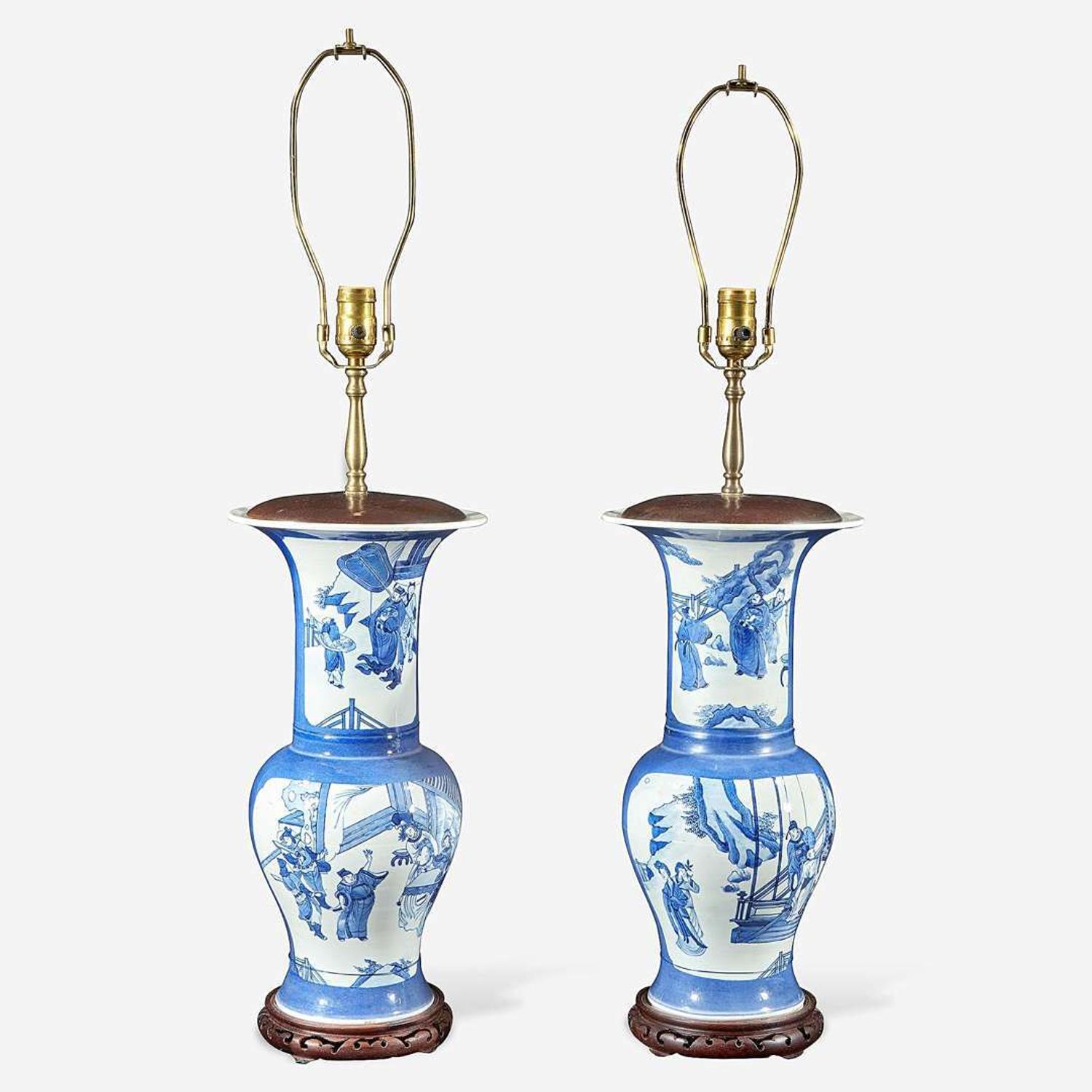 A pair of Chinese blue and white powder-blue ground “Phoenix-tail” vases mounted as lamps Kangxi style