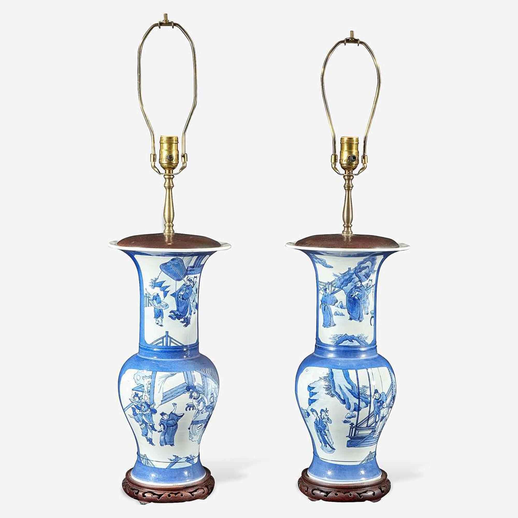 A pair of Chinese blue and white powder-blue ground “Phoenix-tail” vases mounted as lamps Kangxi style