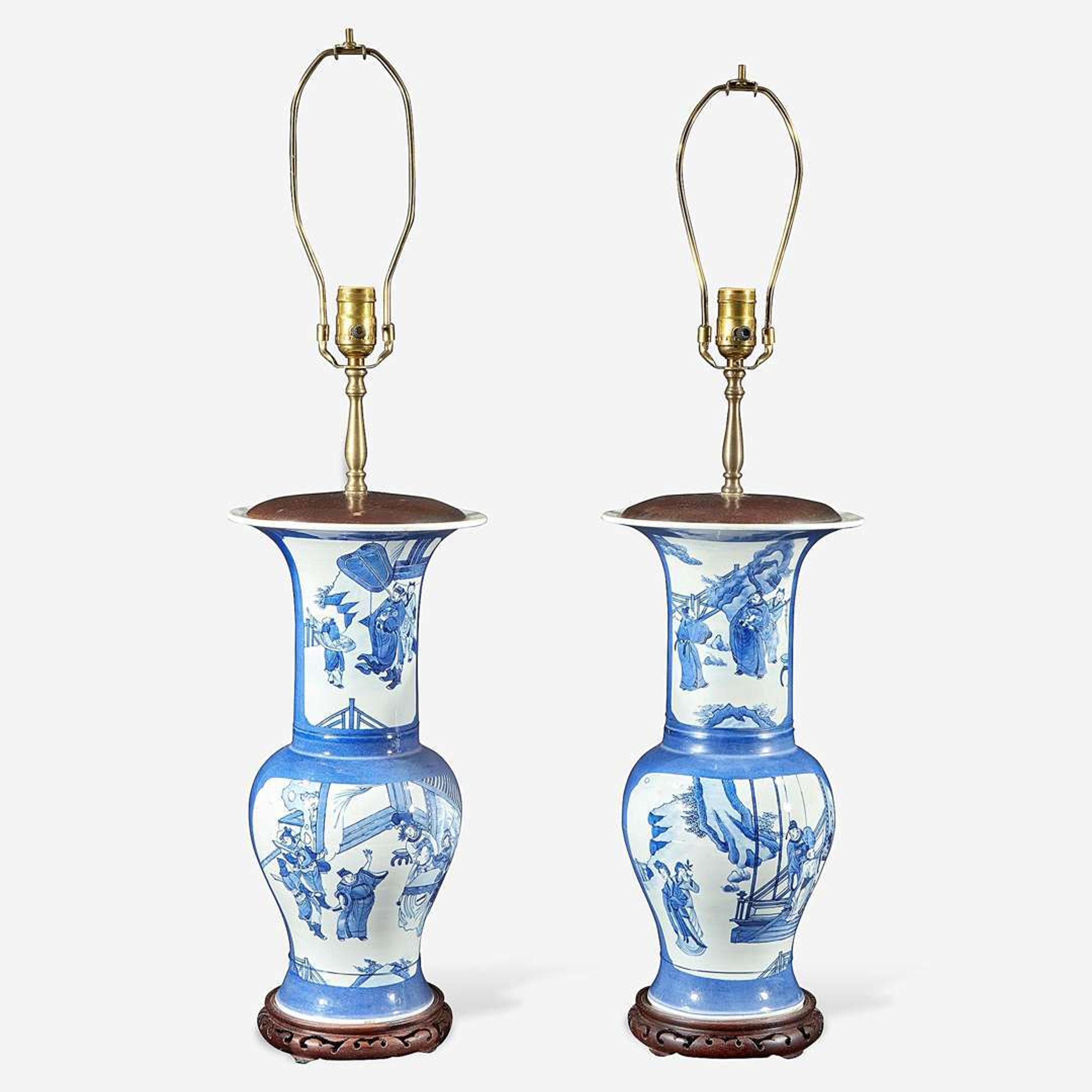 A pair of Chinese blue and white powder-blue ground “Phoenix-tail” vases mounted as lamps Kangxi style