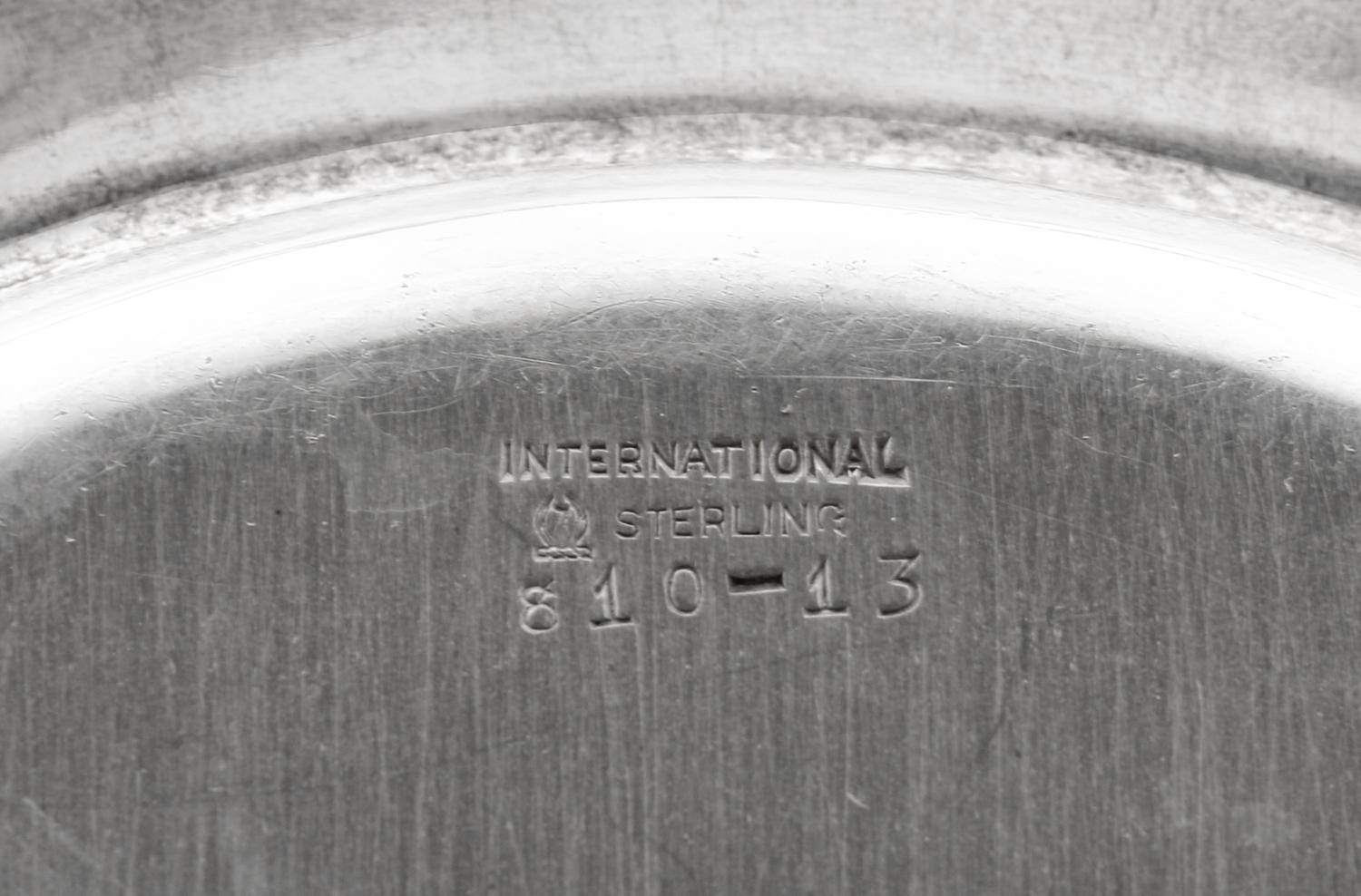 A Set of Sixteen American Silver Bread Plates
