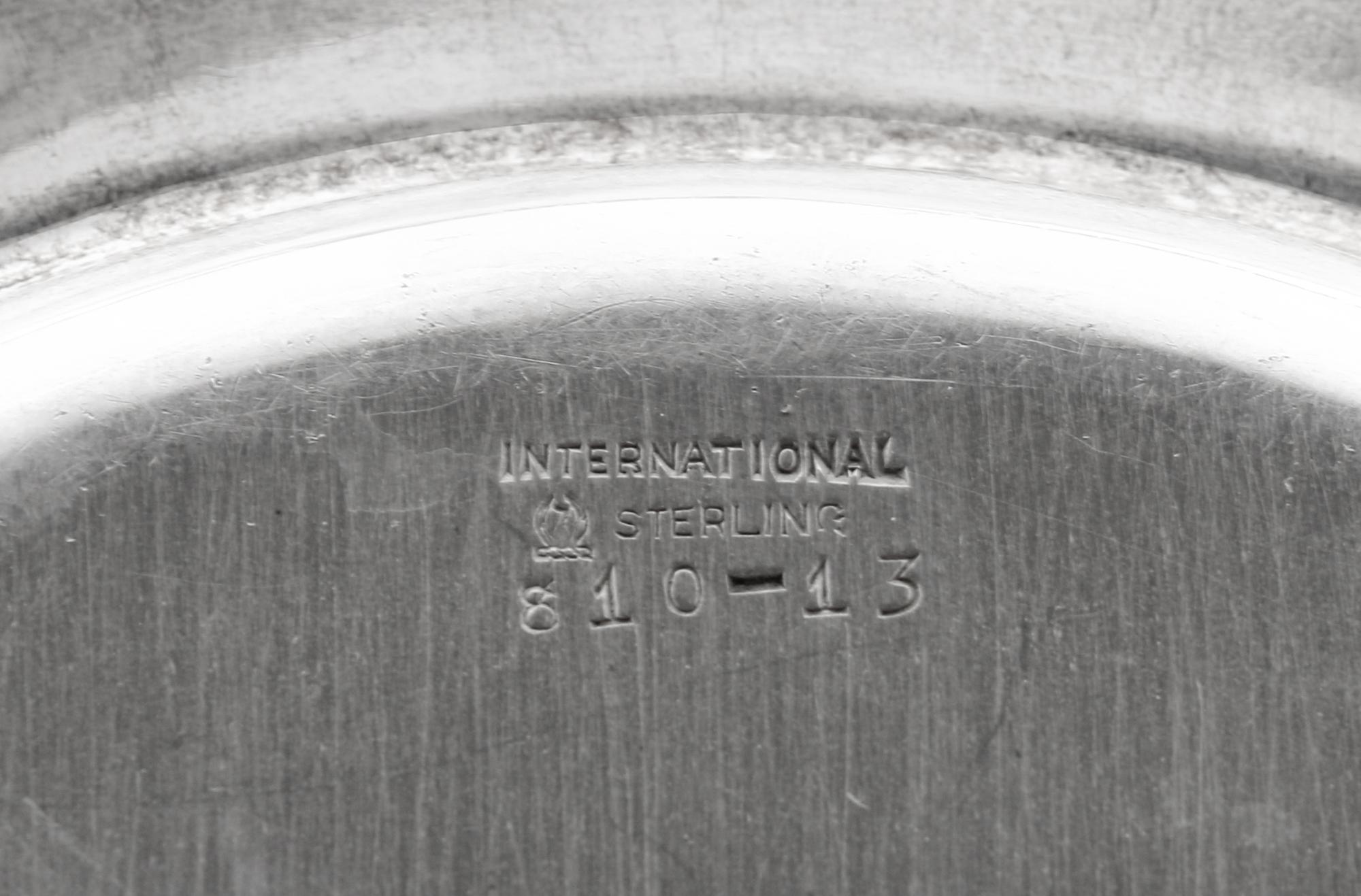 A Set of Sixteen American Silver Bread Plates